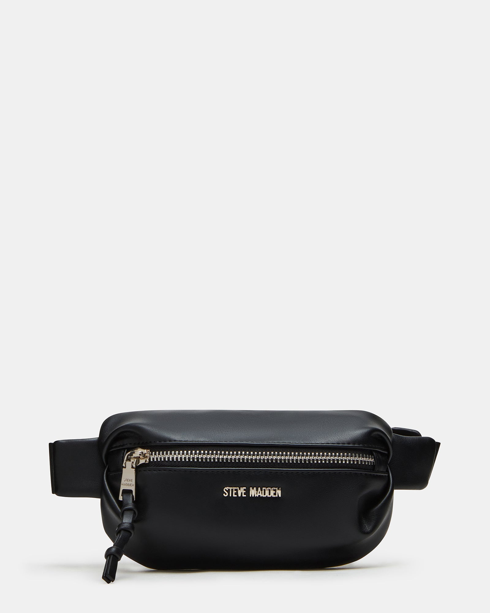 Black pleated baguette belt bag worn crossbody in urban setting