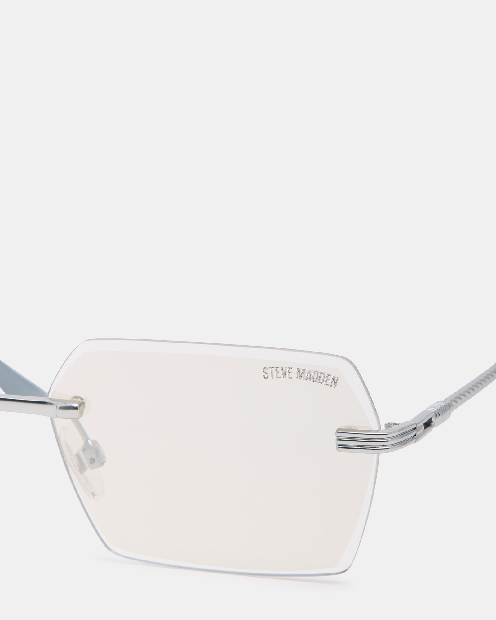 Finian silver aviator sunglasses worn outdoors on a sunny day