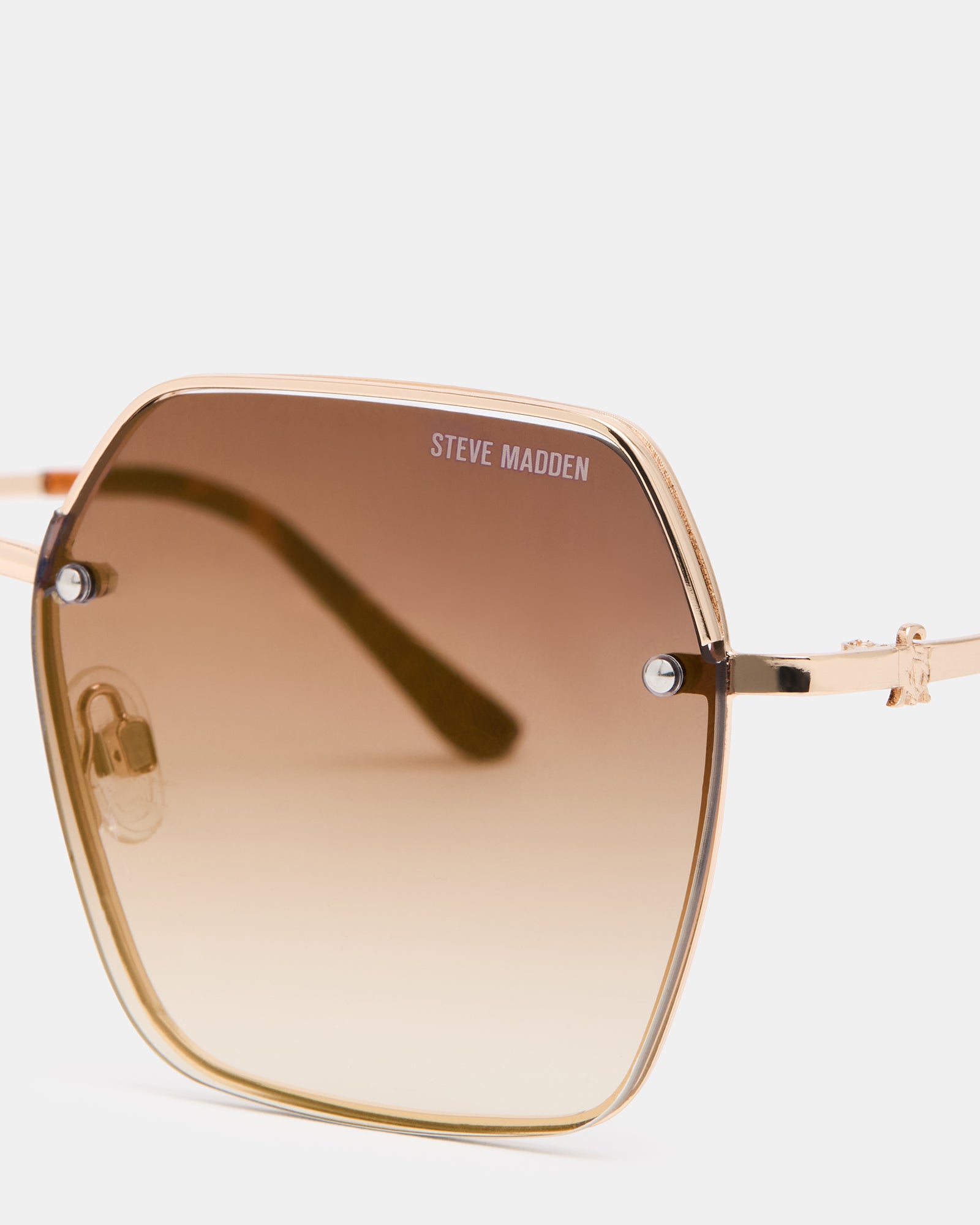 Side angle of DAVIAN sunglasses highlighting the gold tortoise shell pattern