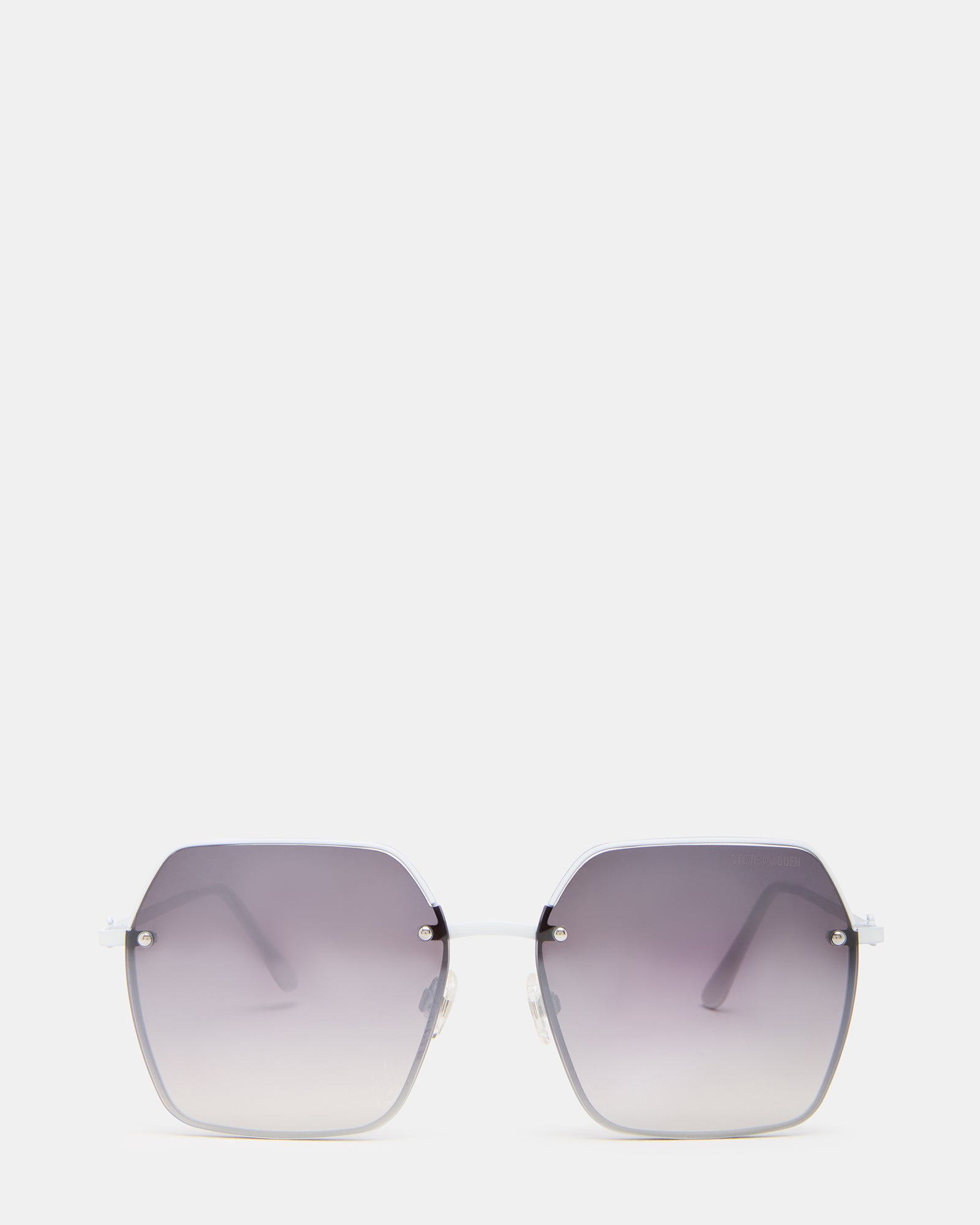 Close-up of white frame designer sunglasses showcasing smoke gradient lenses.