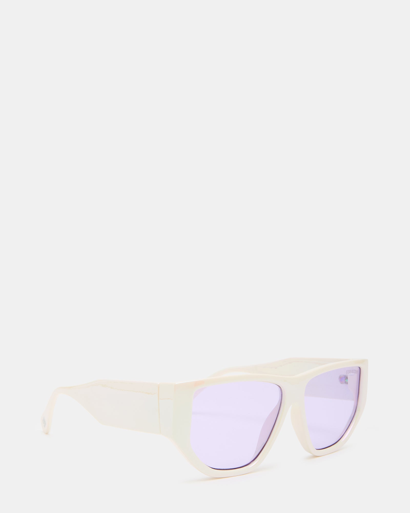Man wearing off-white Virgil sunglasses against a sunset backdrop