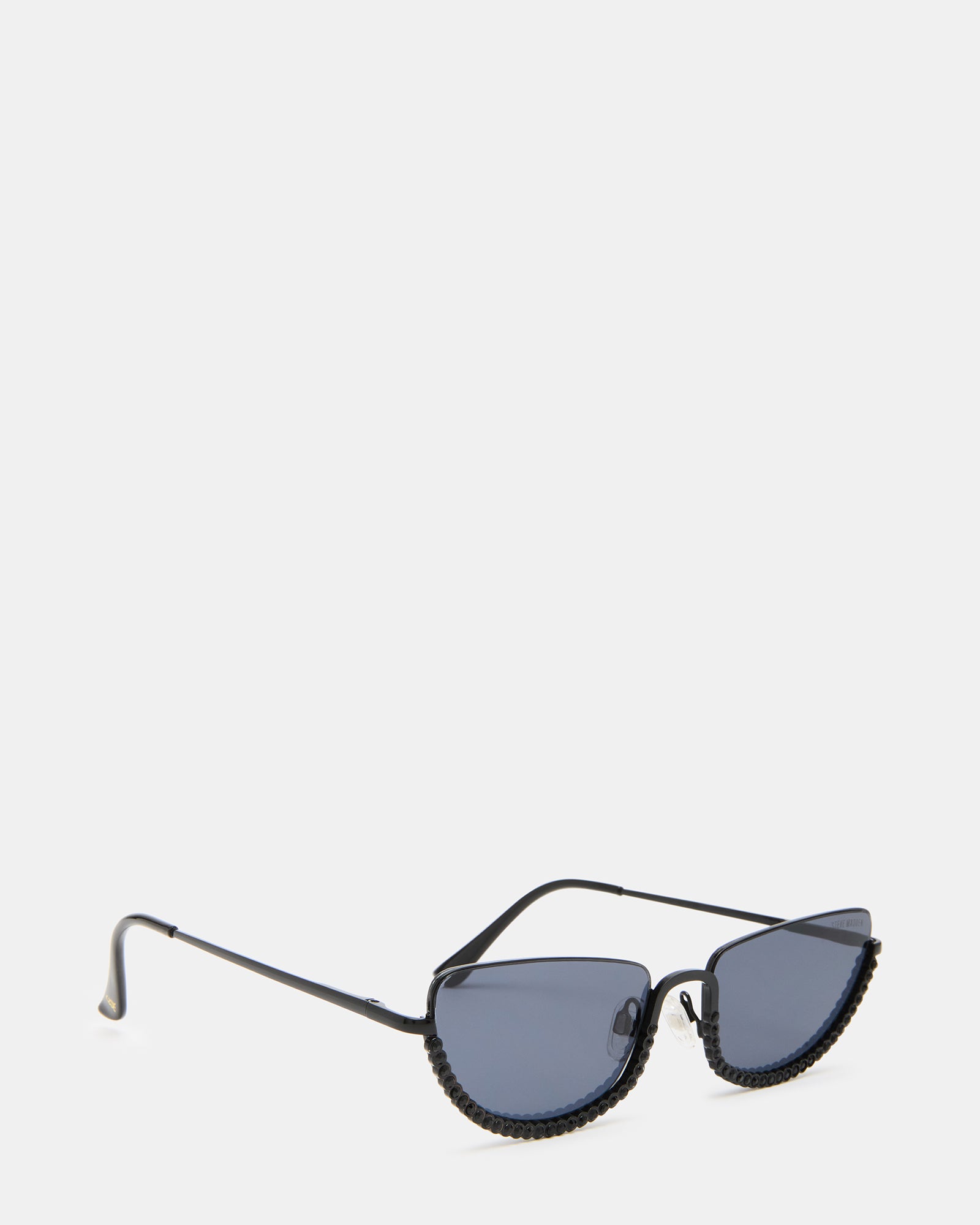 Rickles sunglasses displayed on concrete ledge, ready for sunny city wear