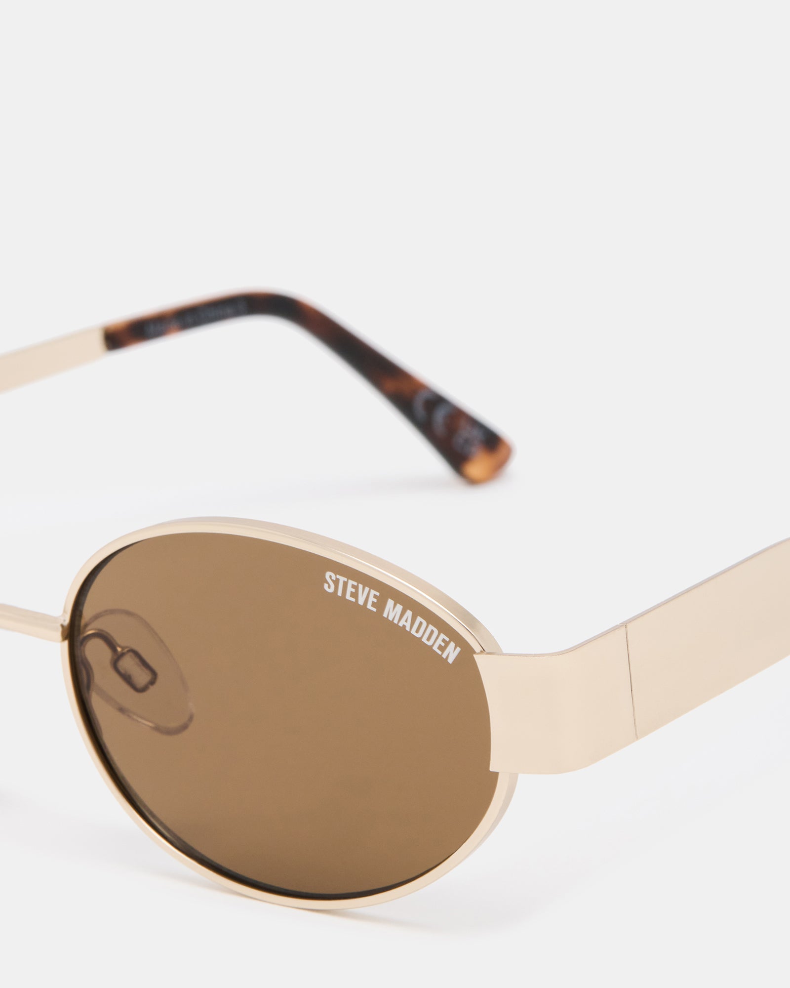 Side angle showing sleek gold frame and temple width