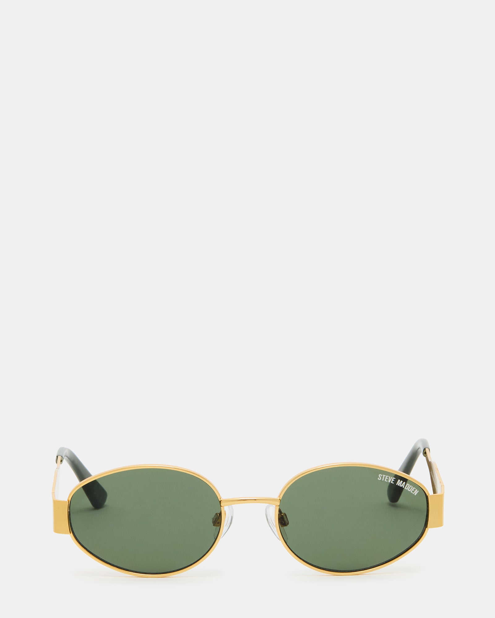 MYSTIE gold frame sunglasses modeled on a woman at the beach