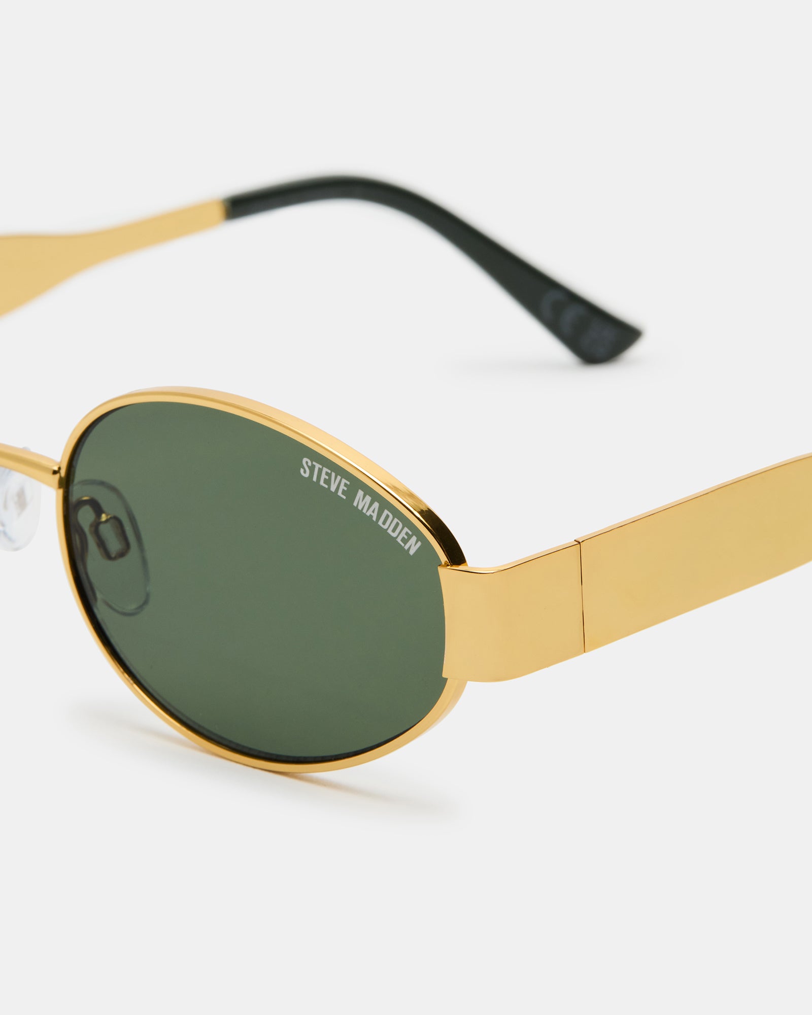 Close-up of UV protection sunglasses showing green lens detail