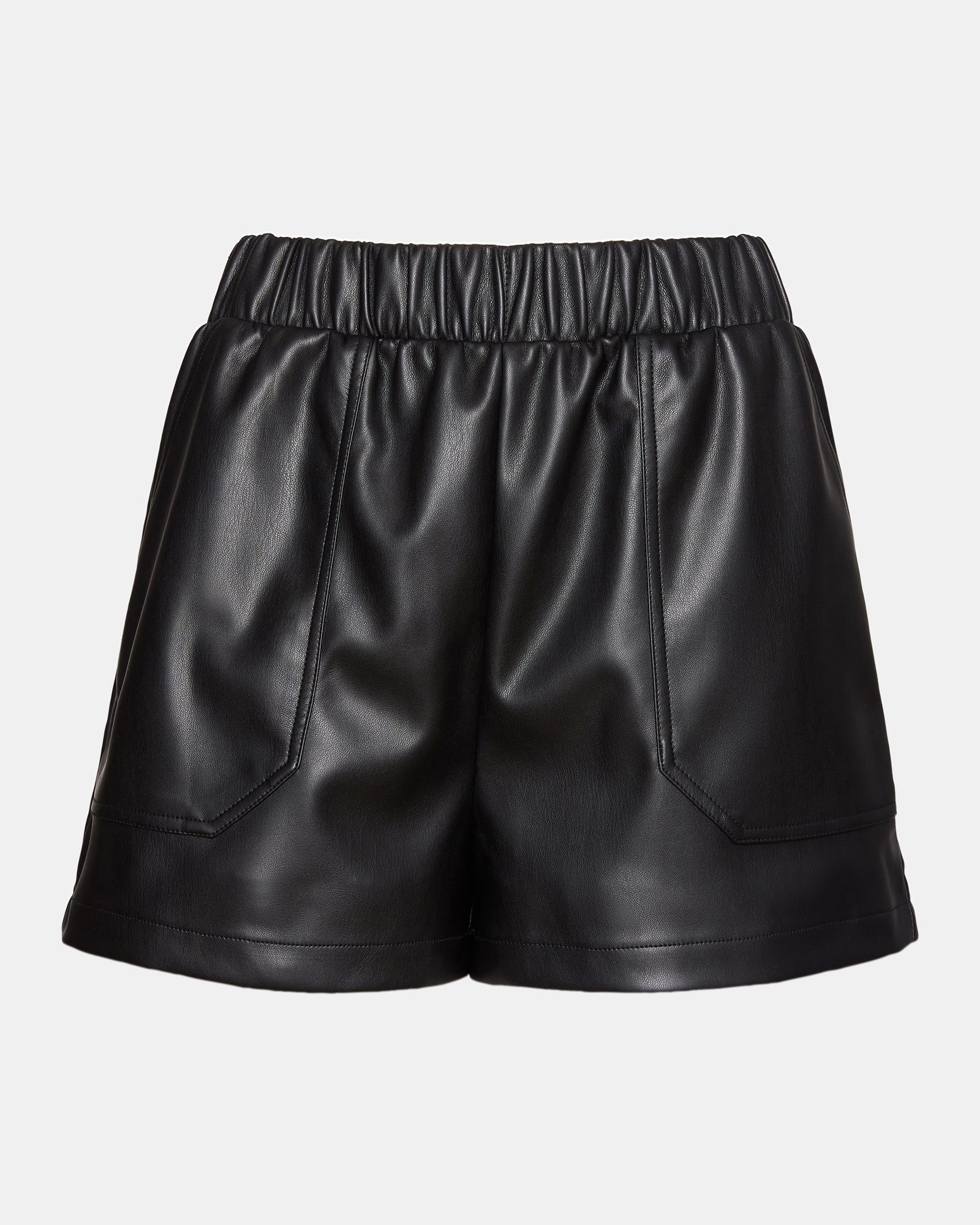 Model showcasing the shorts with heels for a night-out vibe.