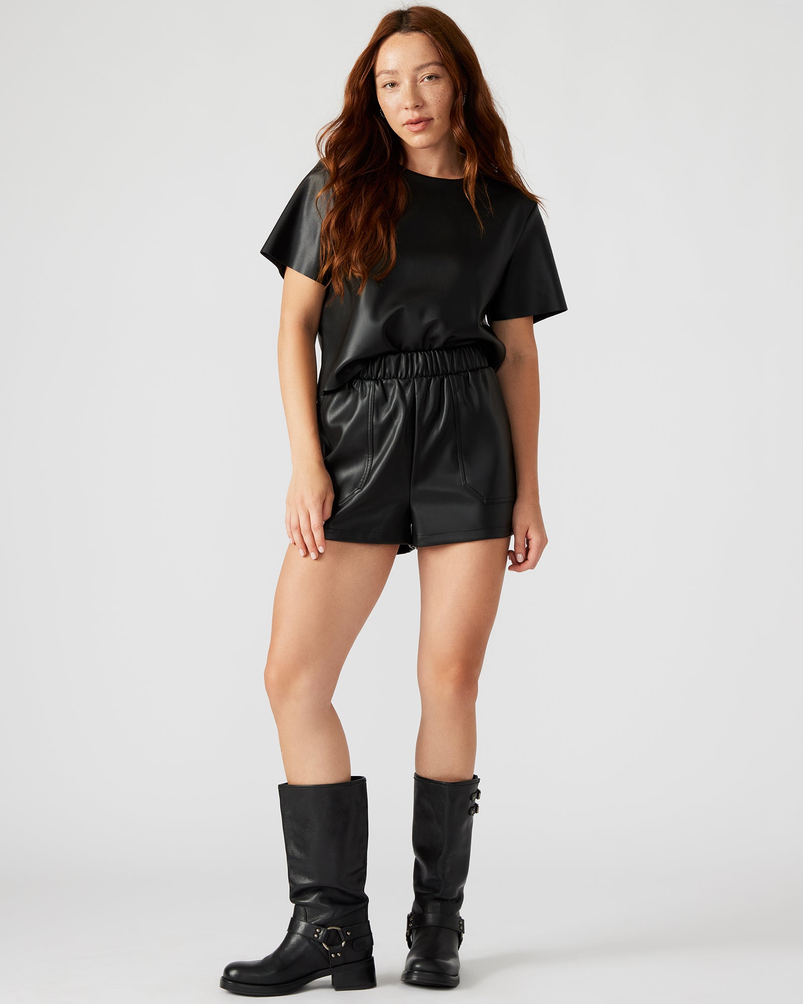 Black micro shorts worn with a crop top for a casual look.