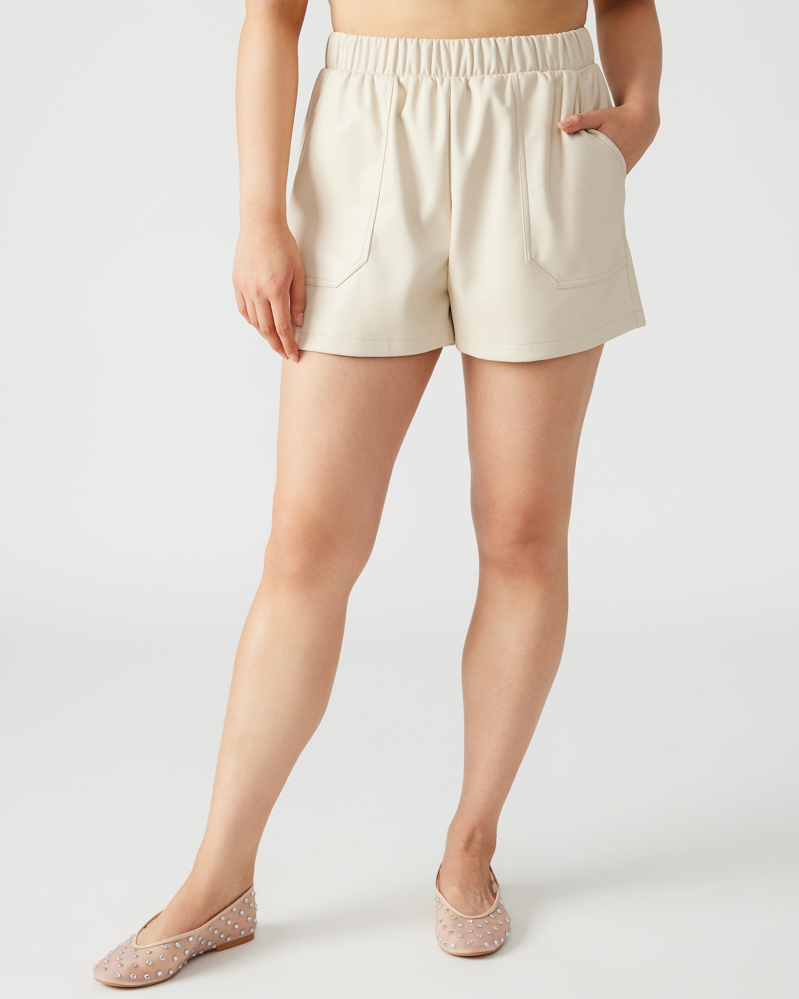 Side view of shorts emphasizing functional pockets and waistband fit.