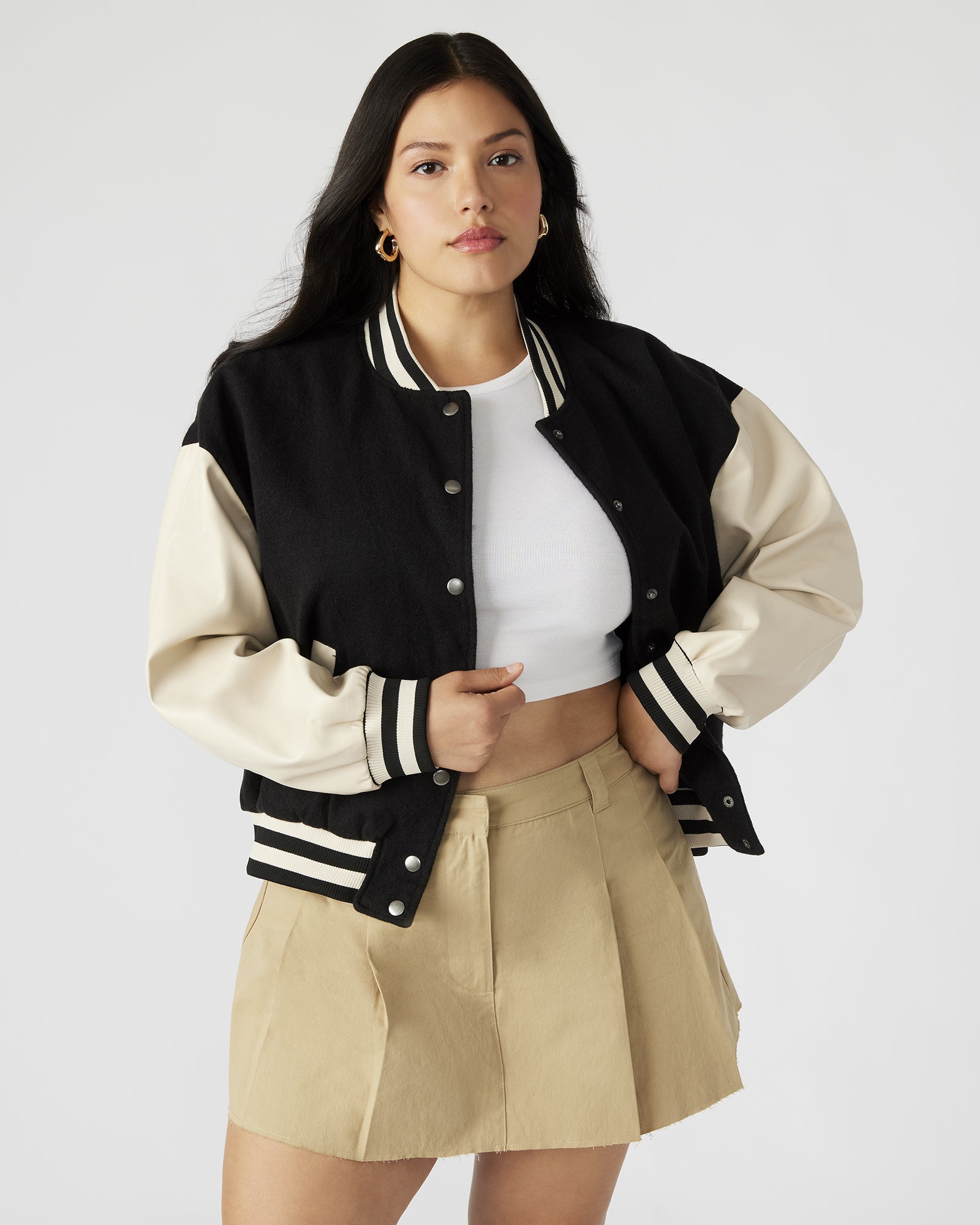 Close-up of the vegan leather sleeves on the Retro Varsity Black Bomber Jacket.
