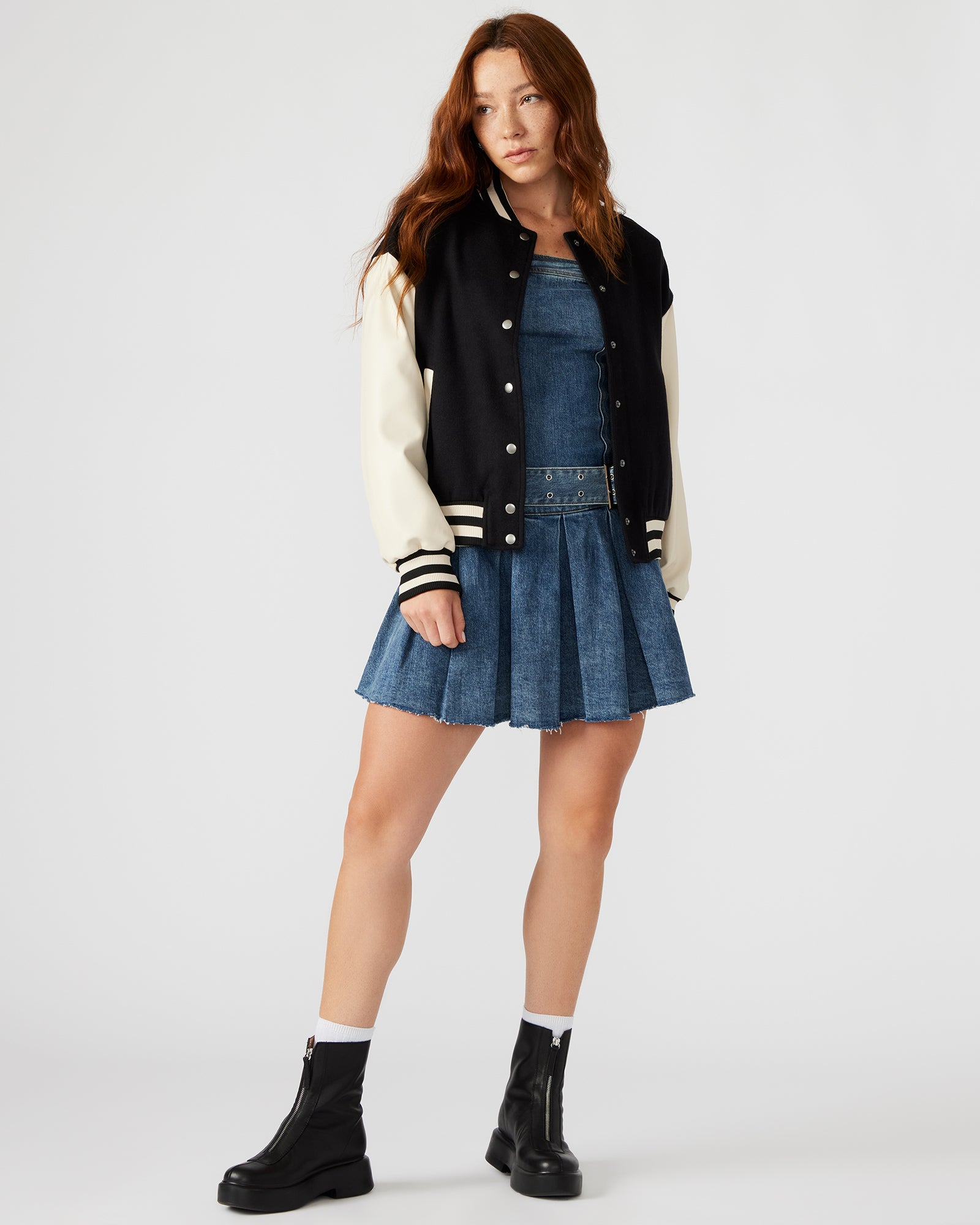 Model wearing the Retro Varsity Black Bomber Jacket styled for a casual day out.