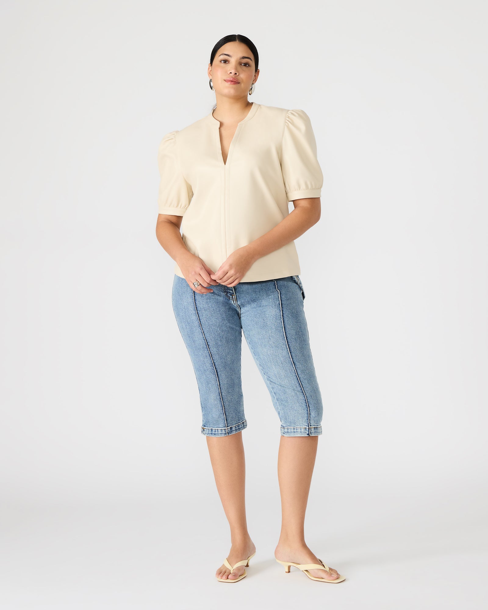 Back view of womens puff sleeve blouse worn casually