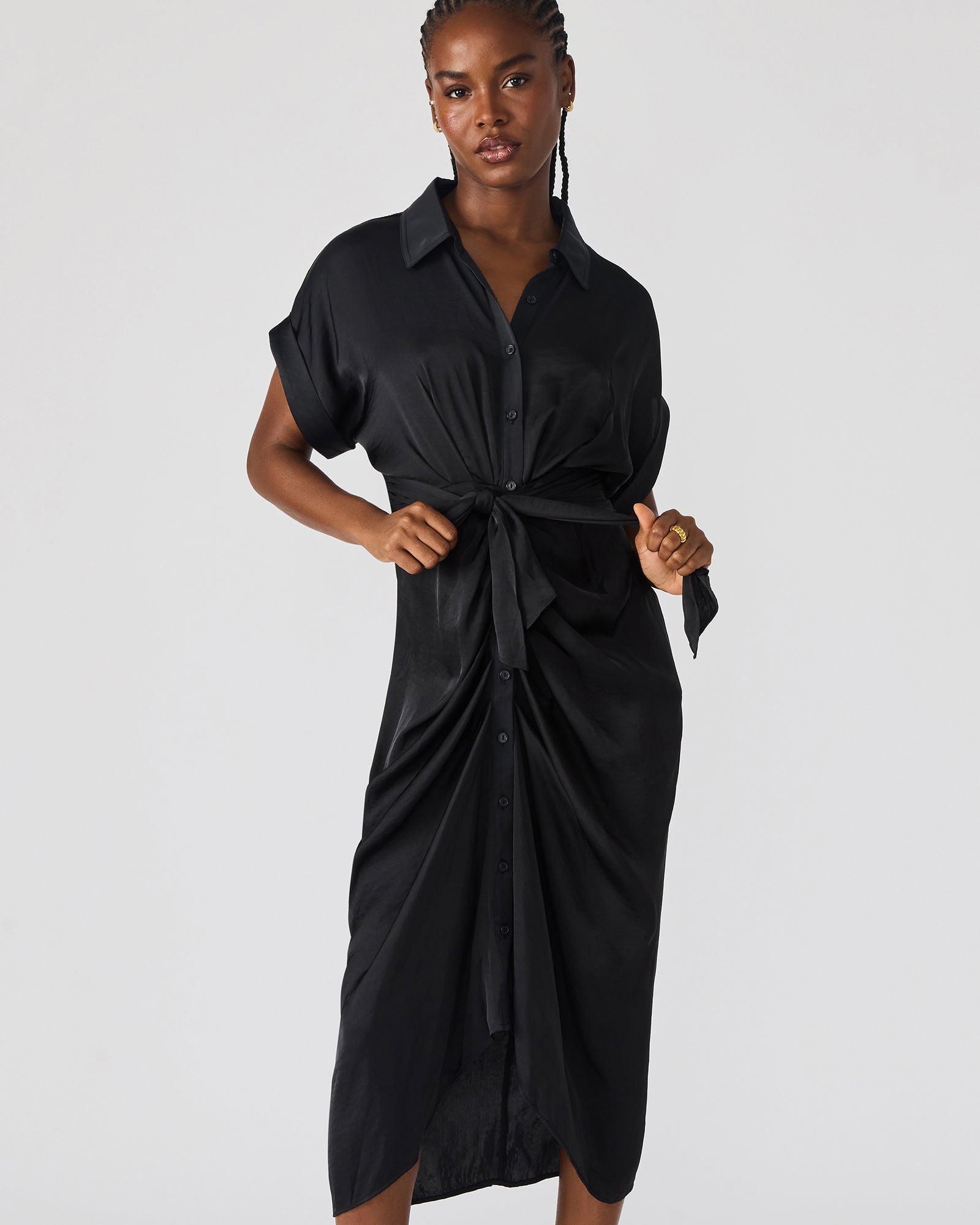 Close-up of the rolled collar and cuffed sleeves of the Tori black midi dress.