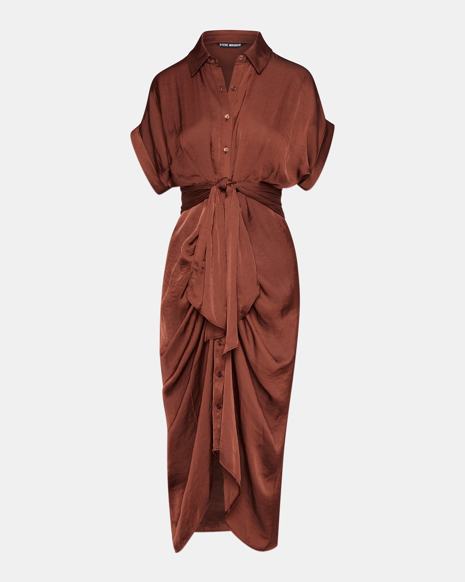 High-low hem and cuffed sleeves of the white midi dress worn with boots