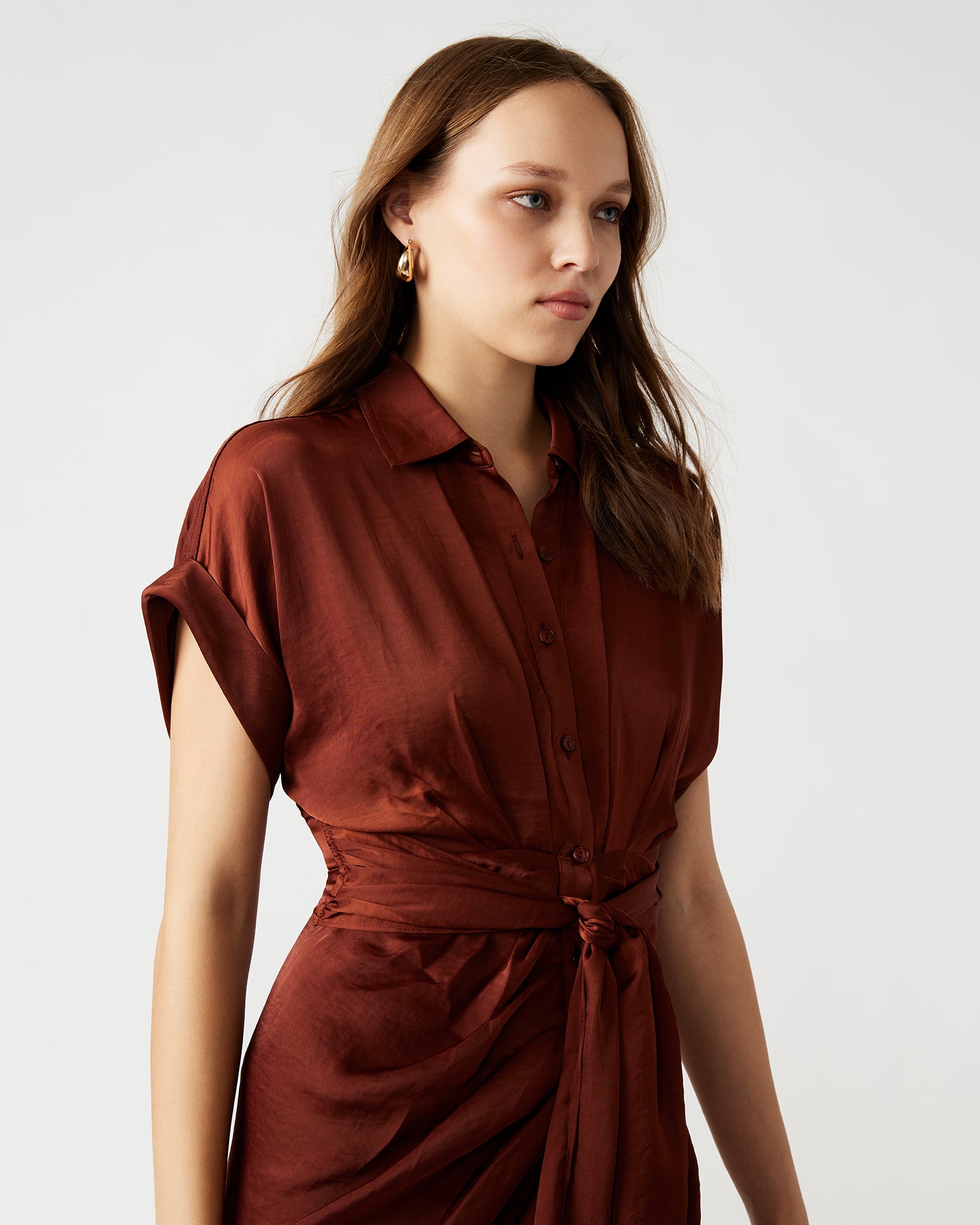 Close-up showing rolled collar and gathered waist detail on shirt dress