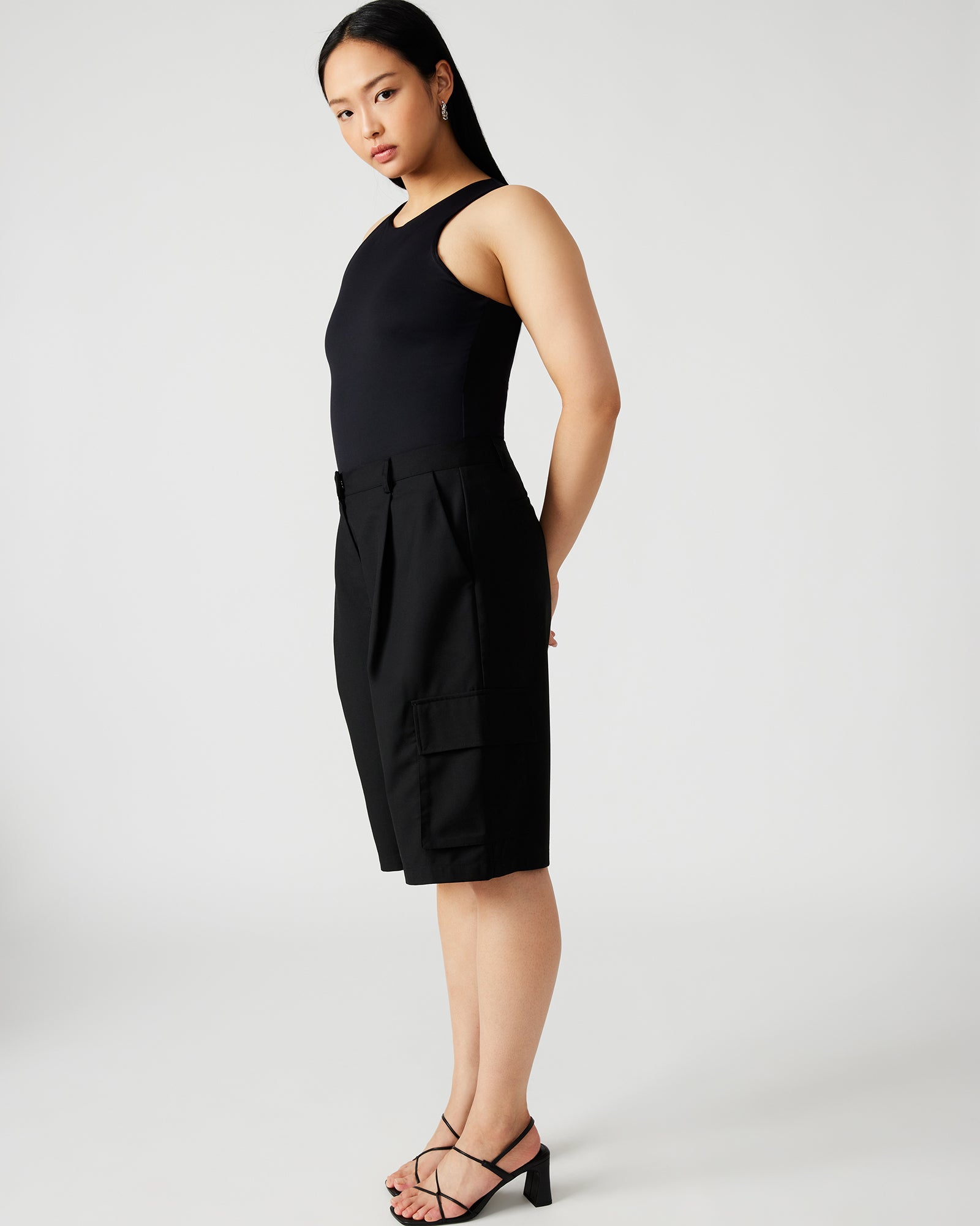 Back view showing bodysuits smooth silhouette with skinny jeans