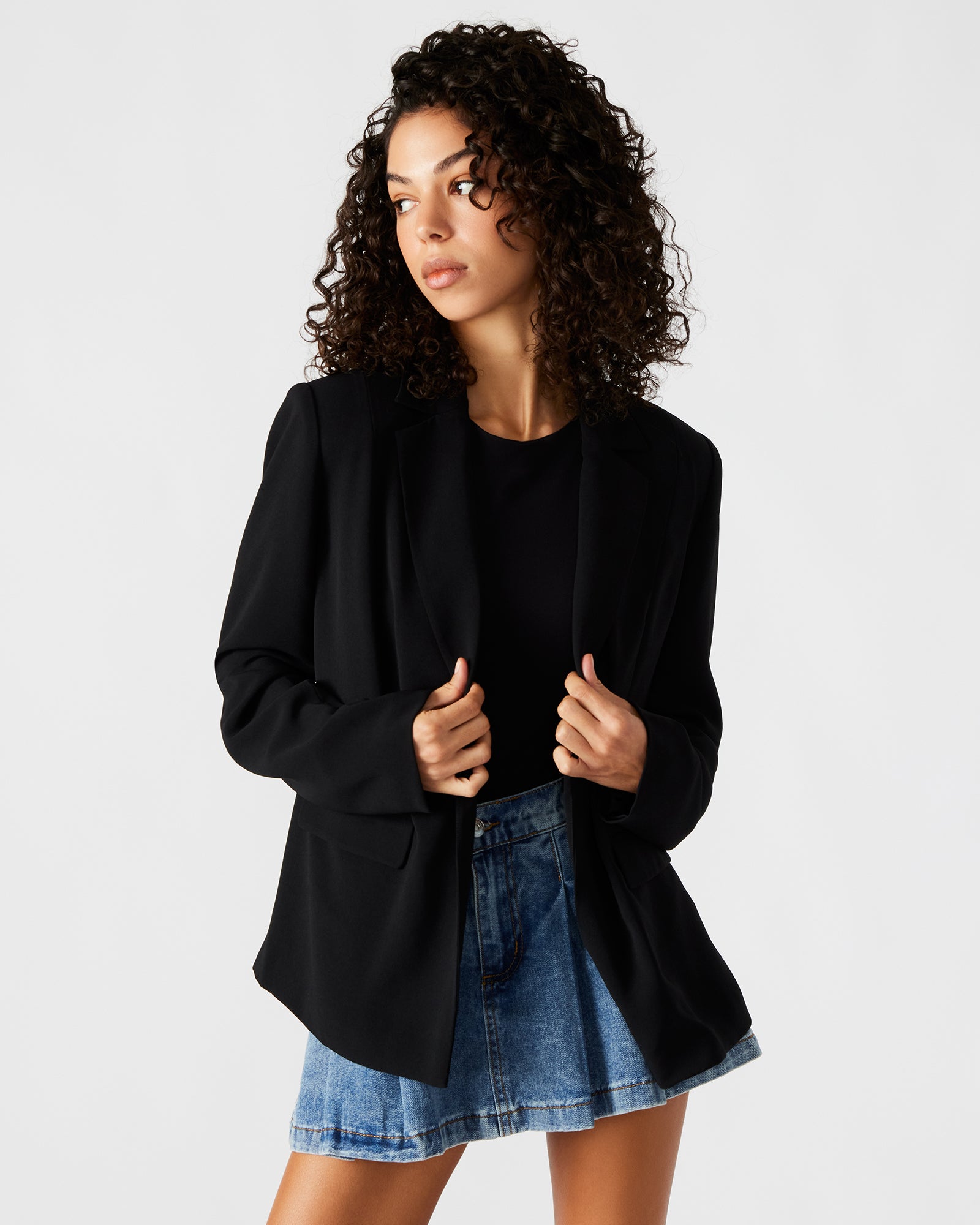 Front view of the Payton black tailored blazer showcasing its open front design.