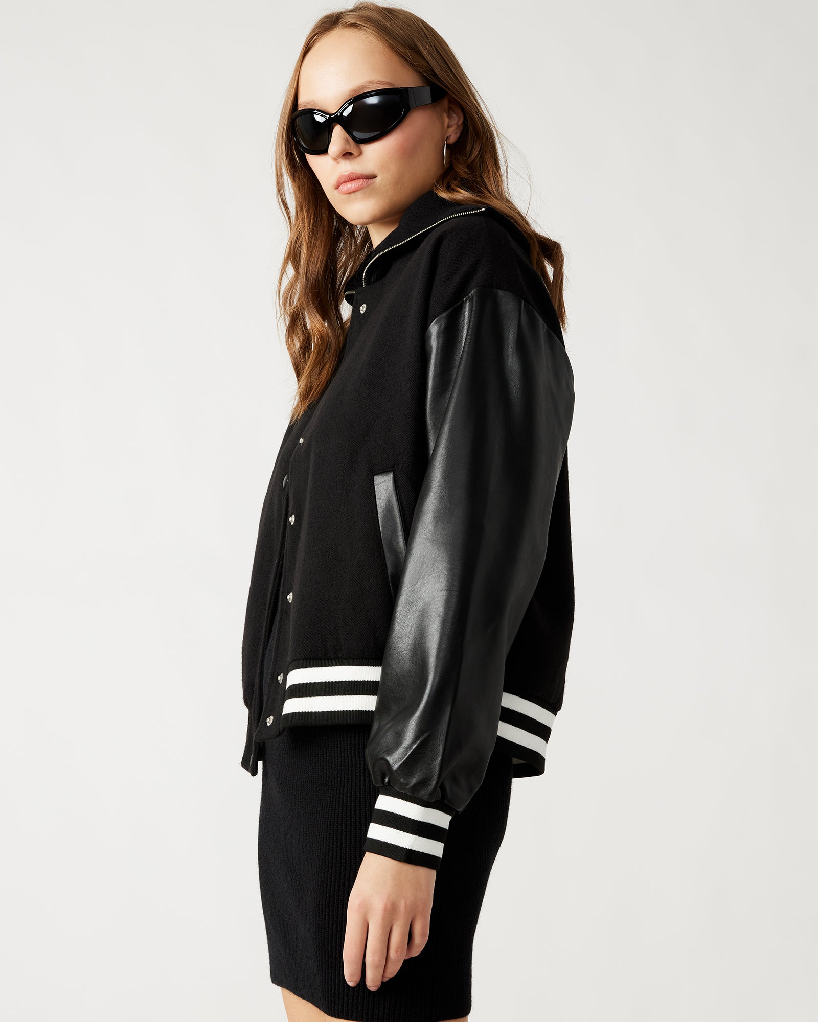 Model wearing Alexandra relaxed fit varsity jacket for casual outings