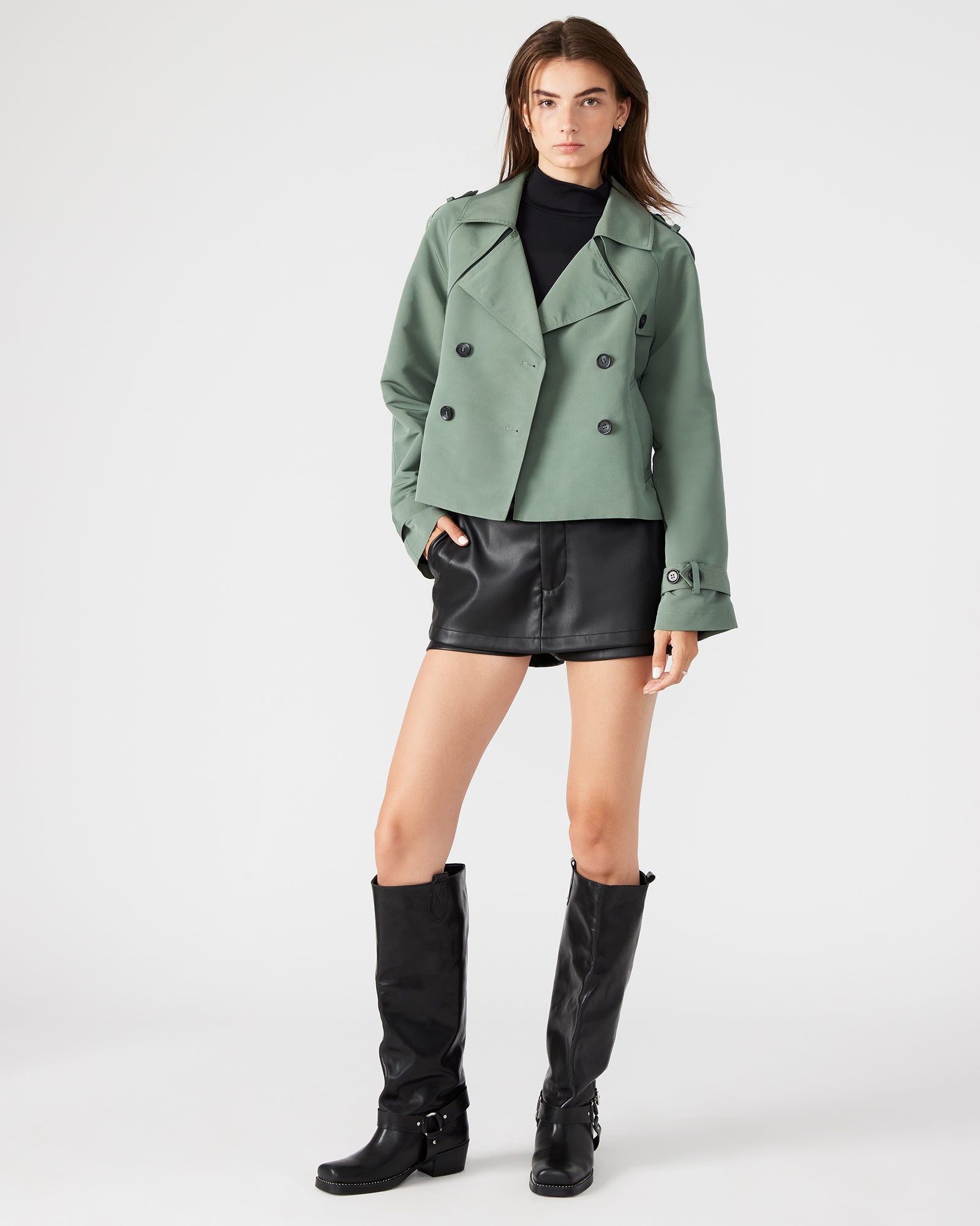Back view of the SIRUS cropped trench coat, featuring the pleated back flap for added flair.