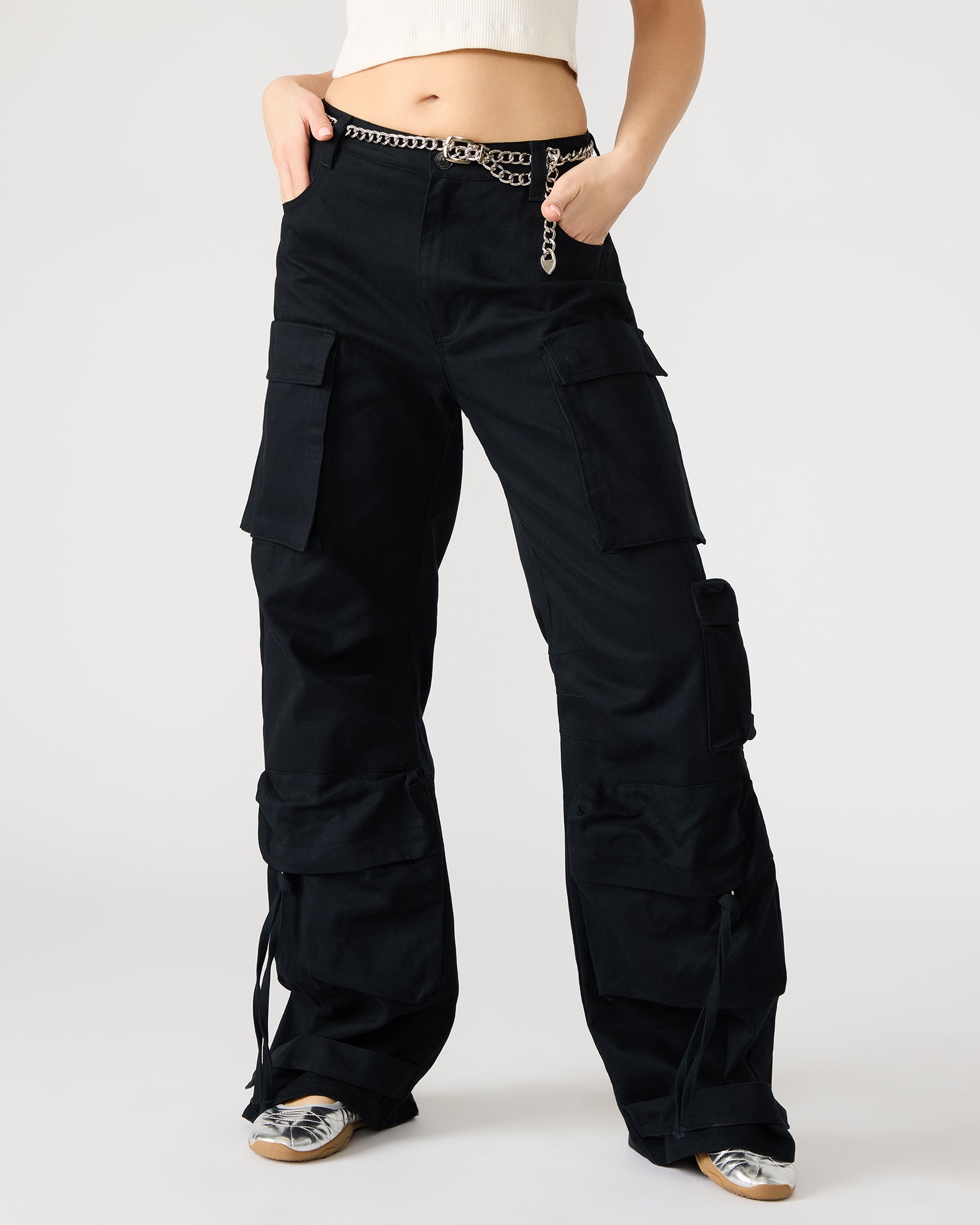Close-up of the snap strap detail on the ankle of the pants