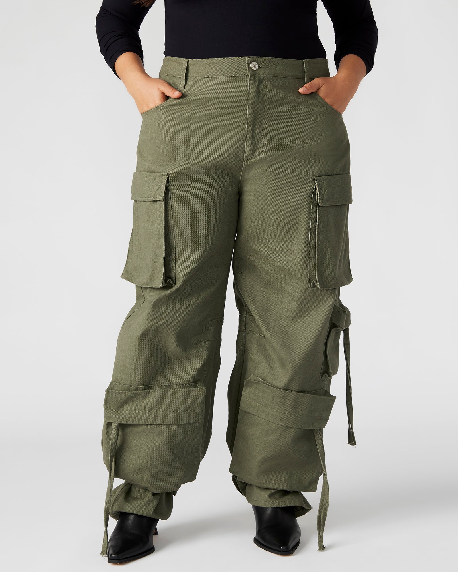 Side profile of model wearing wide leg linen pants with a relaxed fit