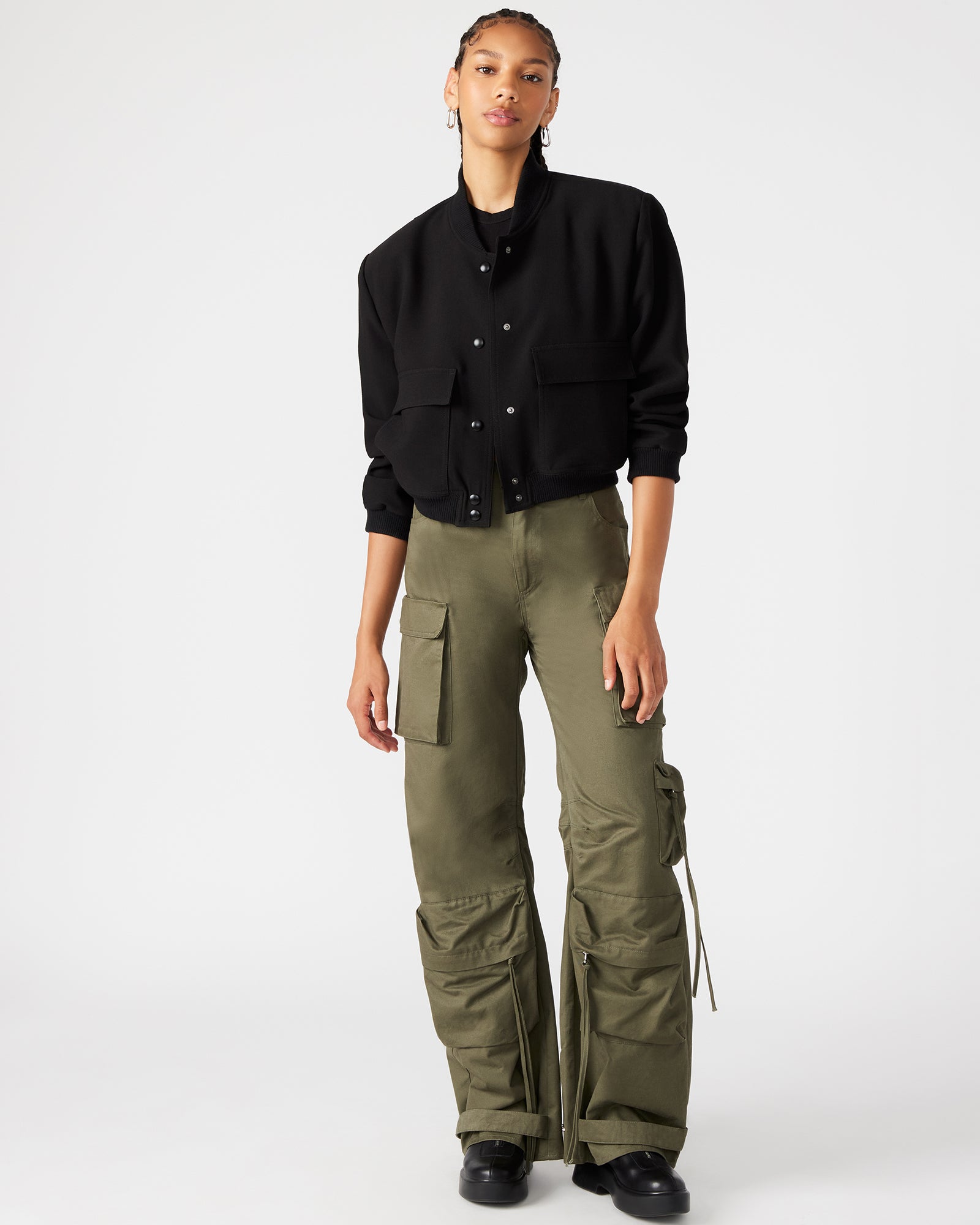 Front view of DUO olive wide leg cargo pants showing adjustable ankle straps