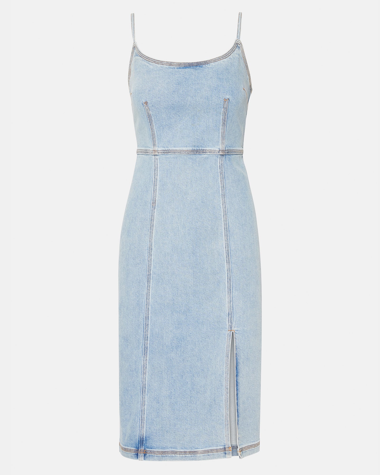 Woman wearing blue denim midi dress with crossbody bag in city setting