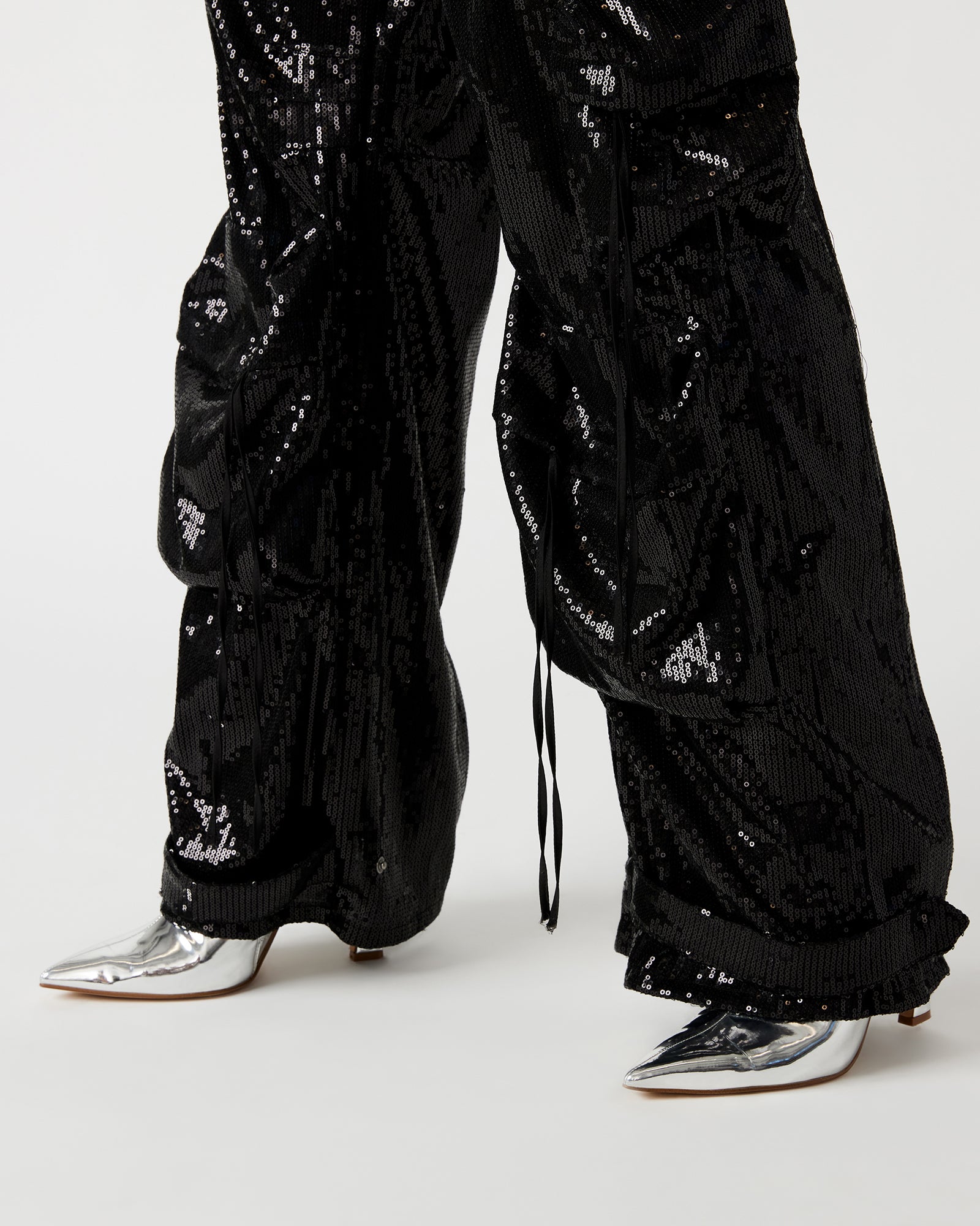 Wide angle of pants in motion showing structured fit and breathability for city walks.