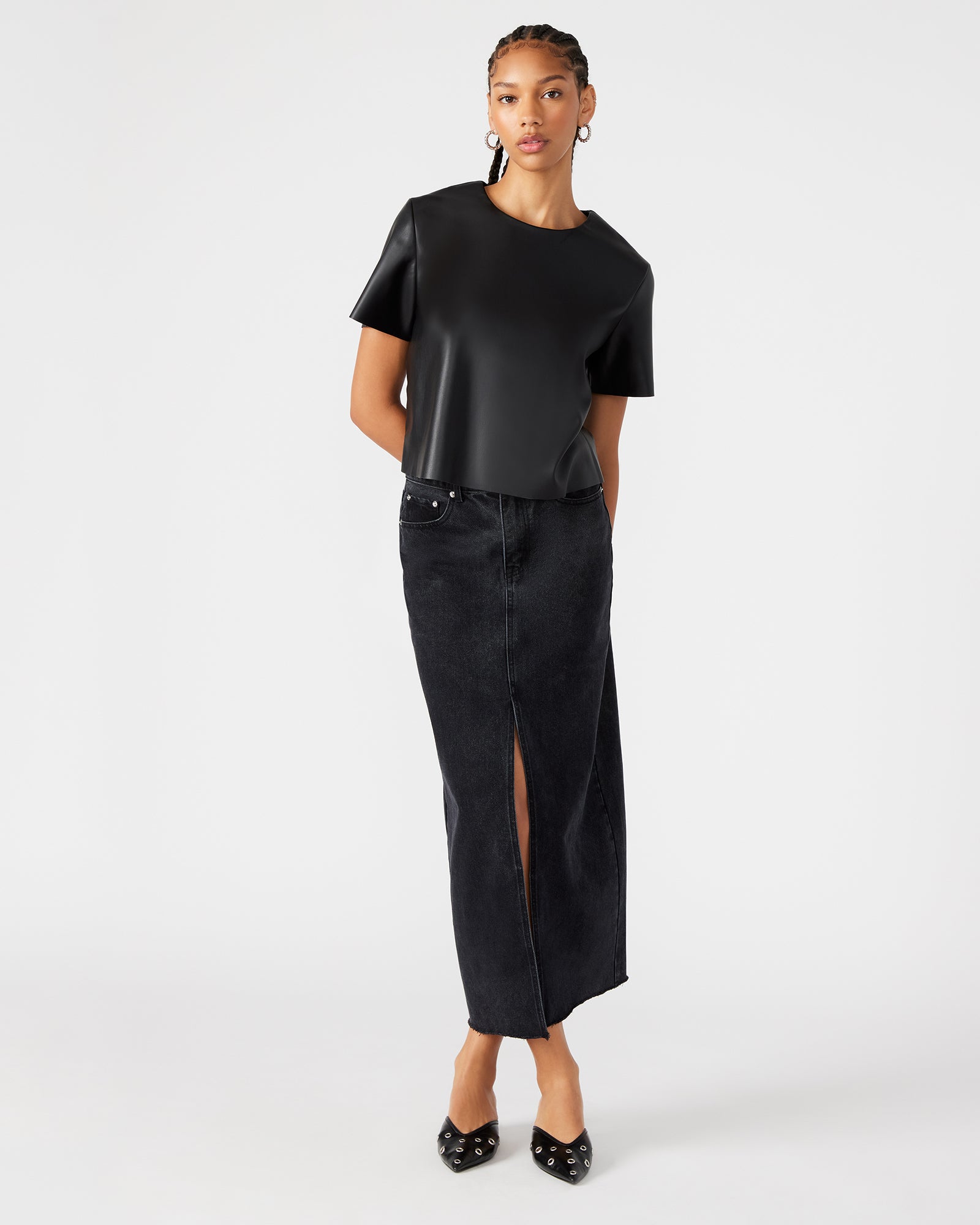 Front view of Avani black denim maxi skirt showcasing the front slit.