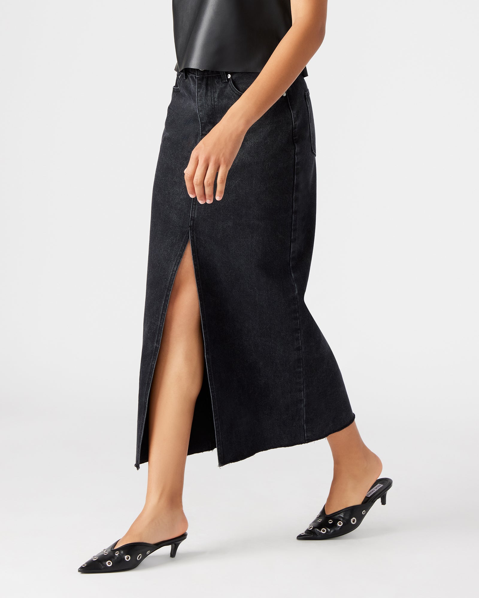 Model wearing the denim maxi skirt in a casual outdoor setting.