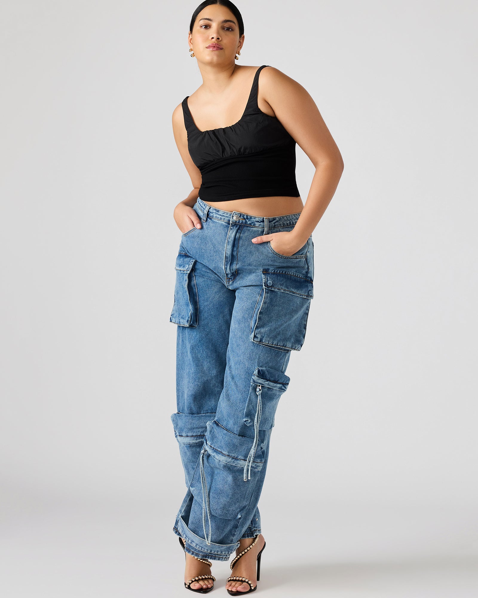Side angle of womens cargo pants highlighting storage pockets.