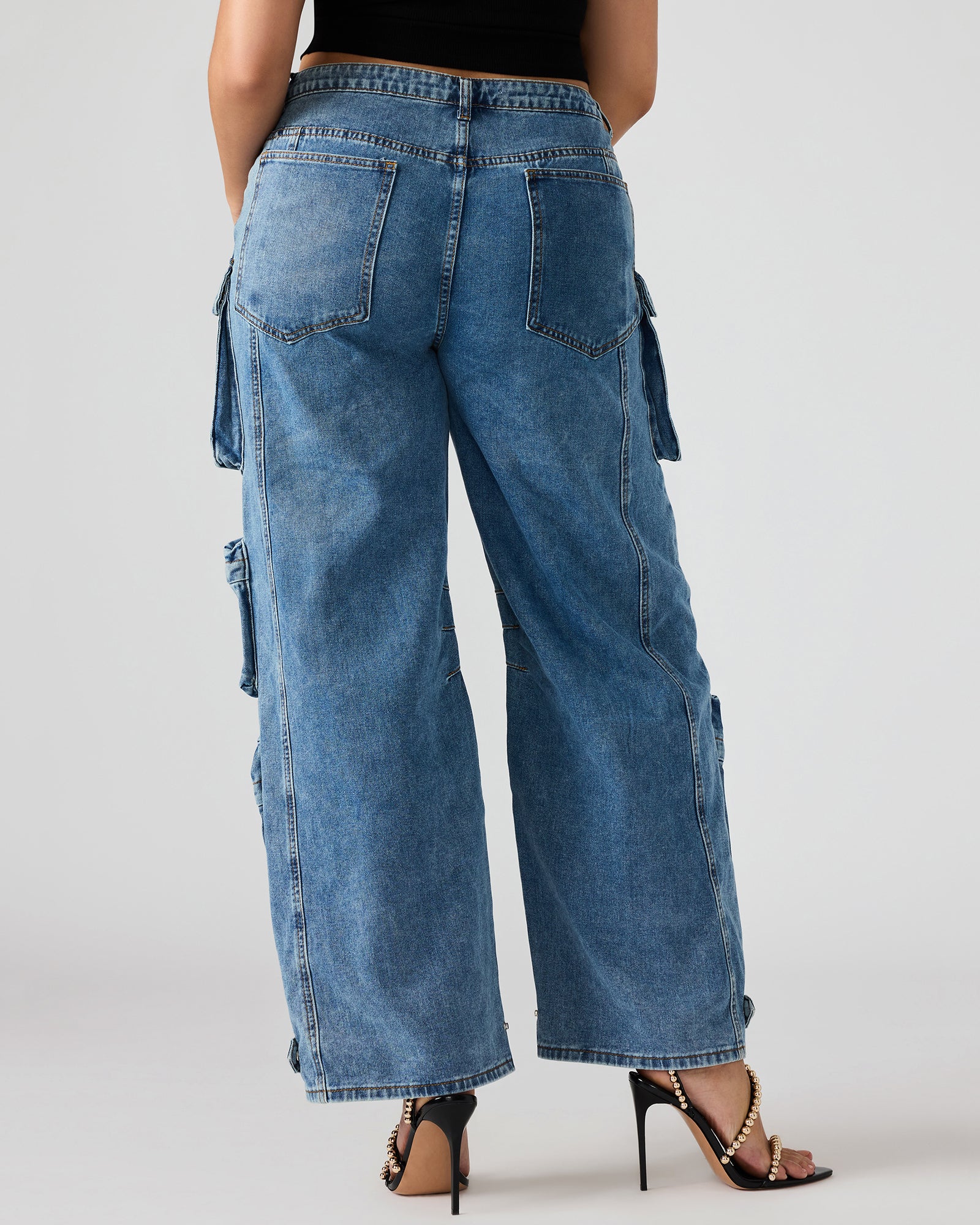 Side angle of womens cargo pants highlighting storage pockets.