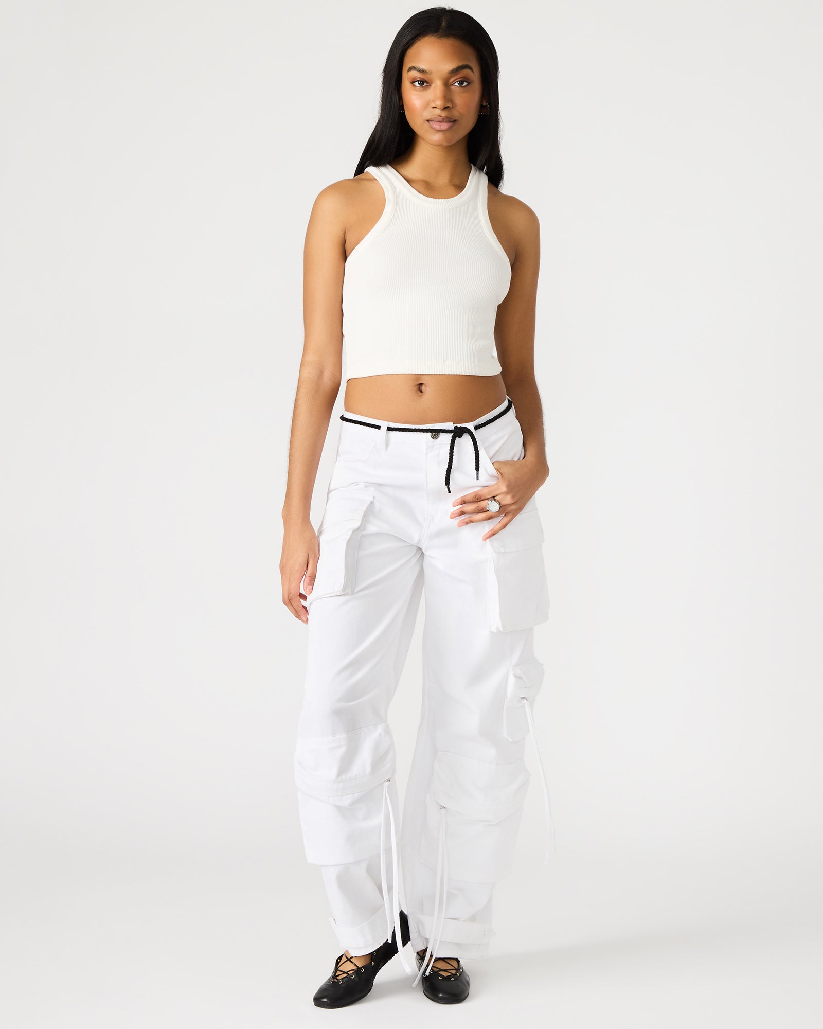 Side view of Duo Wide Leg Cargo Pants in White, highlighting adjustable ankle straps and pockets.