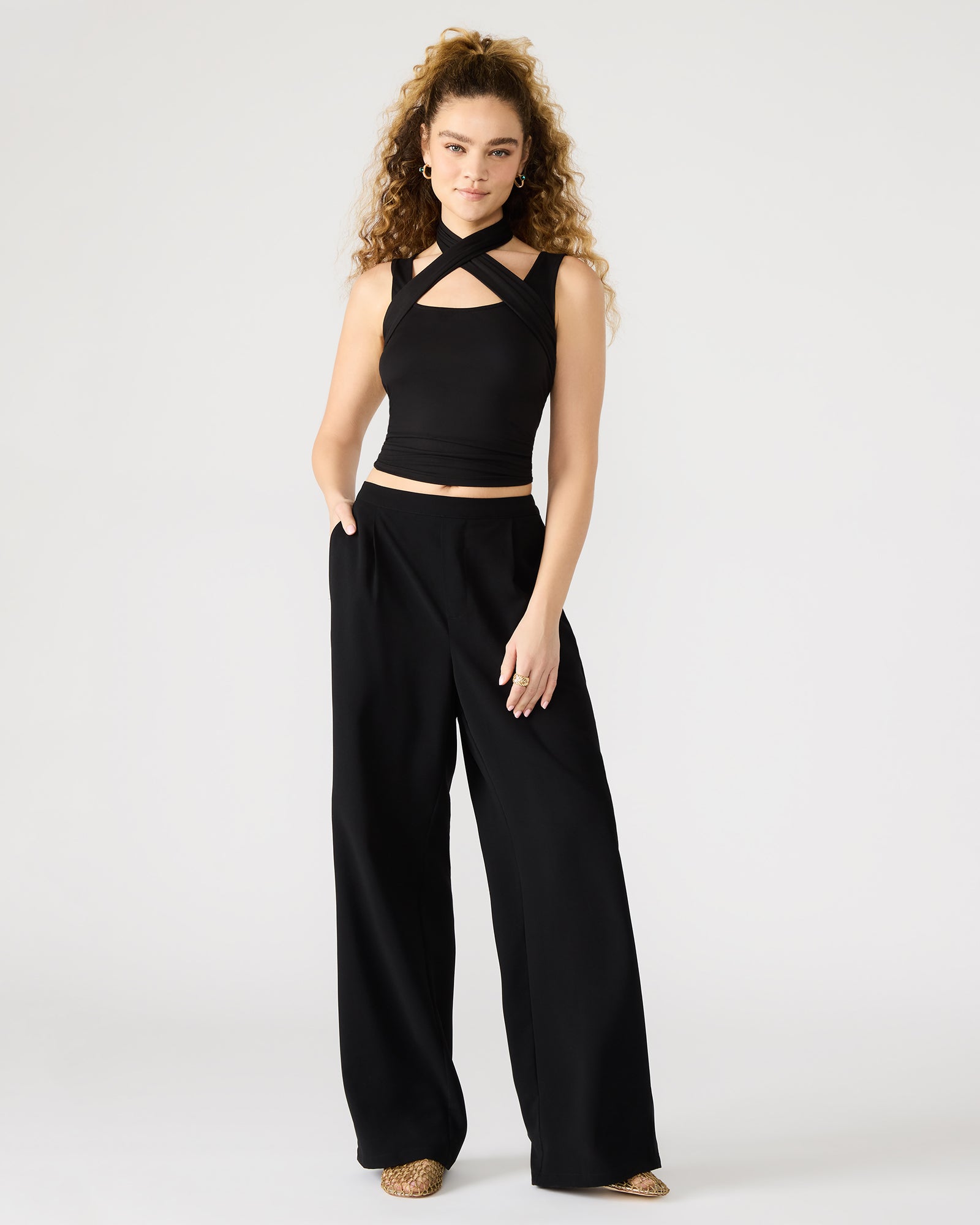 Close-up of pleat details on wide leg linen pants
