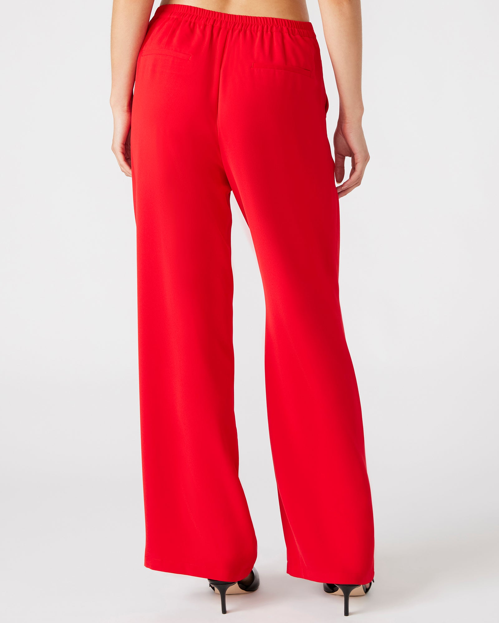 Model wearing wide leg Payton trousers, perfect for a casual outing.