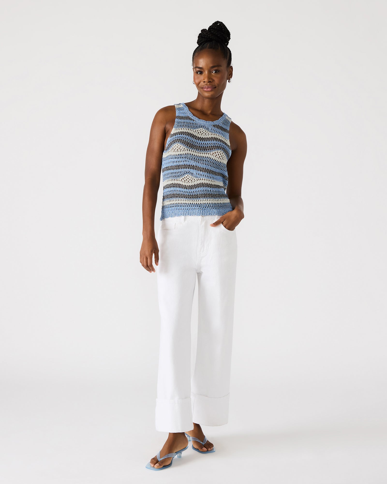 Model wearing the lightweight summer top with sleeves, styled for casual outdoor wear