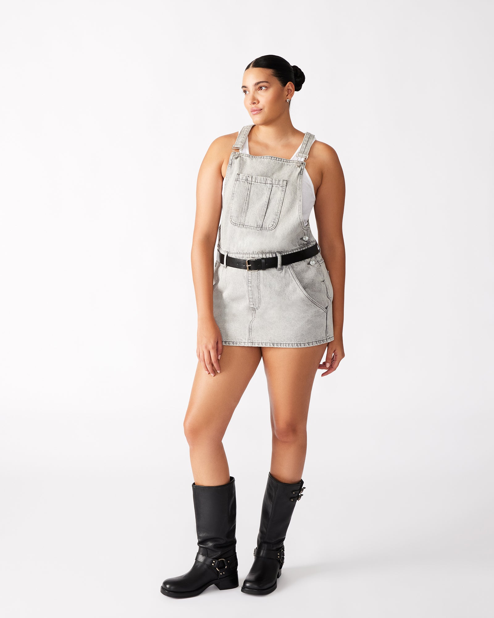 Close-up of the patch pocket and belt on the denim overall dress