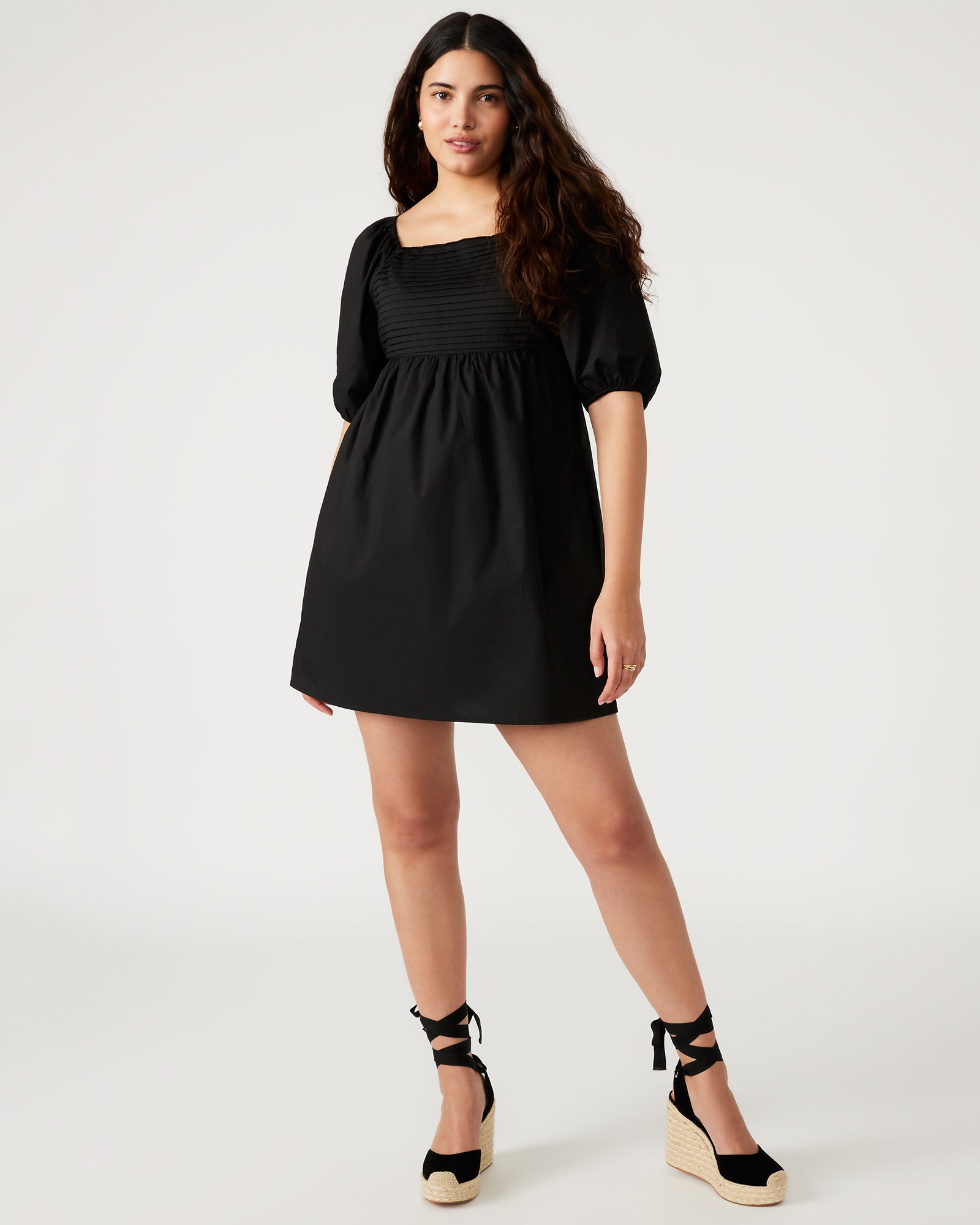 Front view of the black mini dress with puff sleeves and square neckline