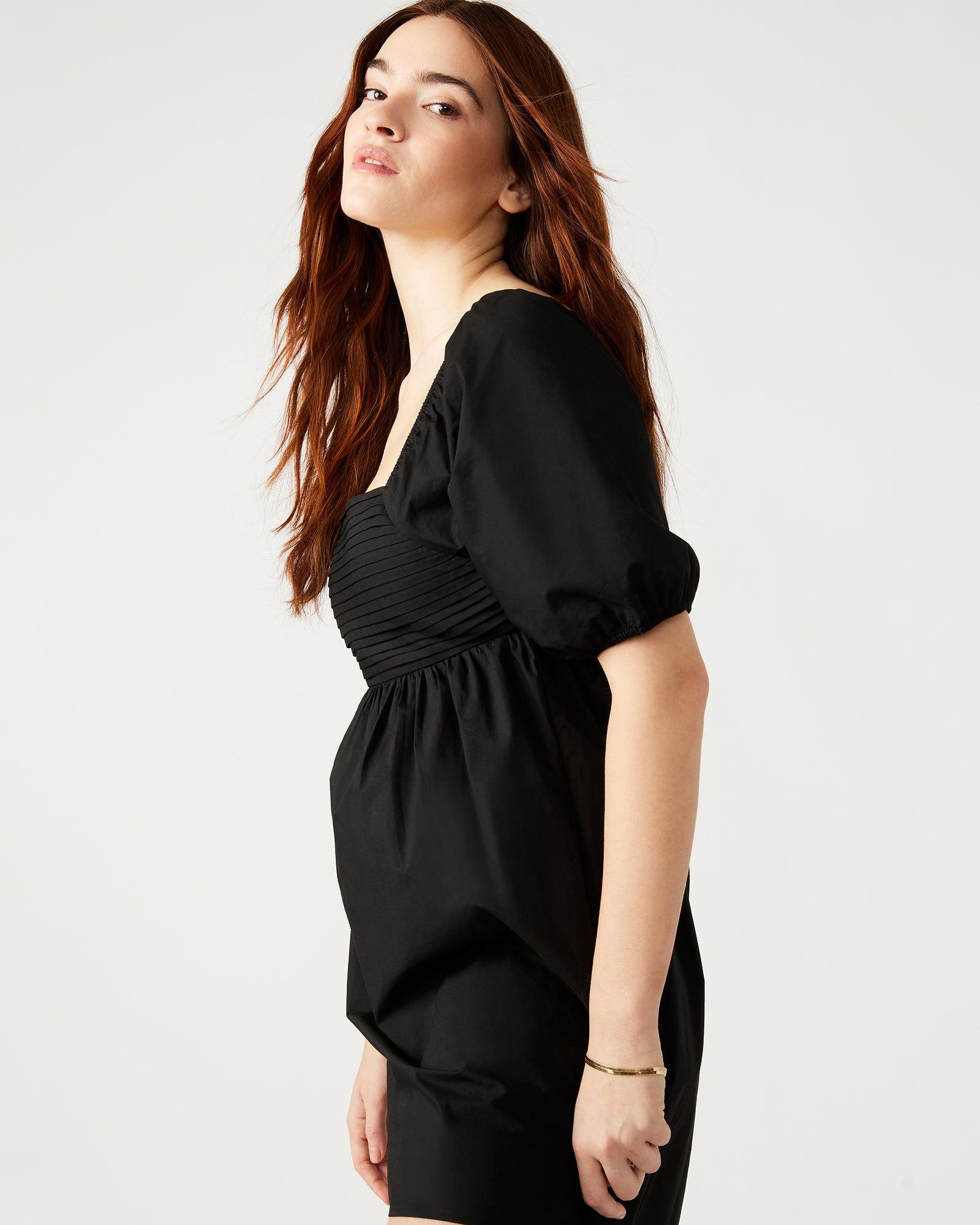 Front view of the black mini dress with puff sleeves and square neckline