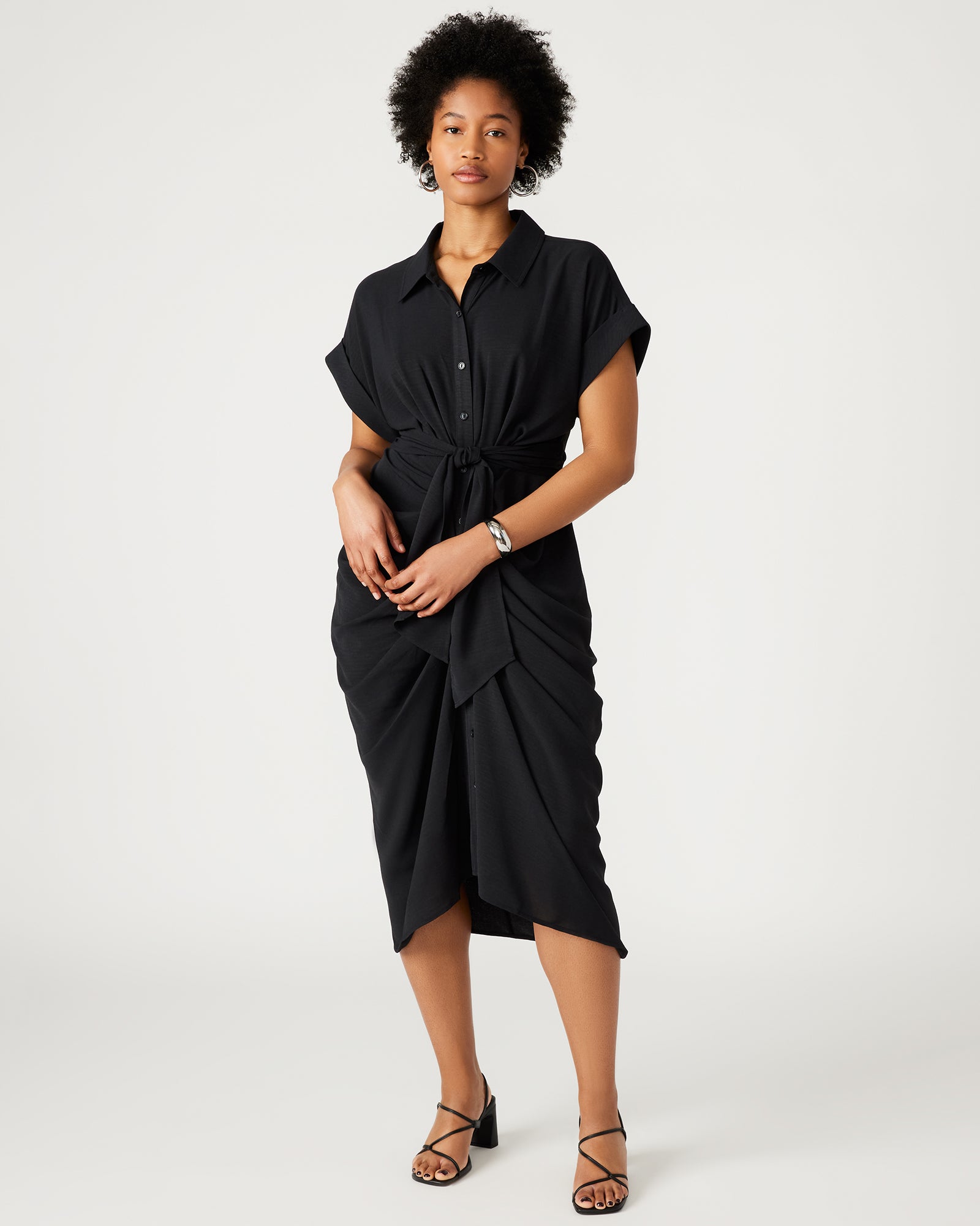 Front view of black midi dress with sleeves, showcasing tie-front detail