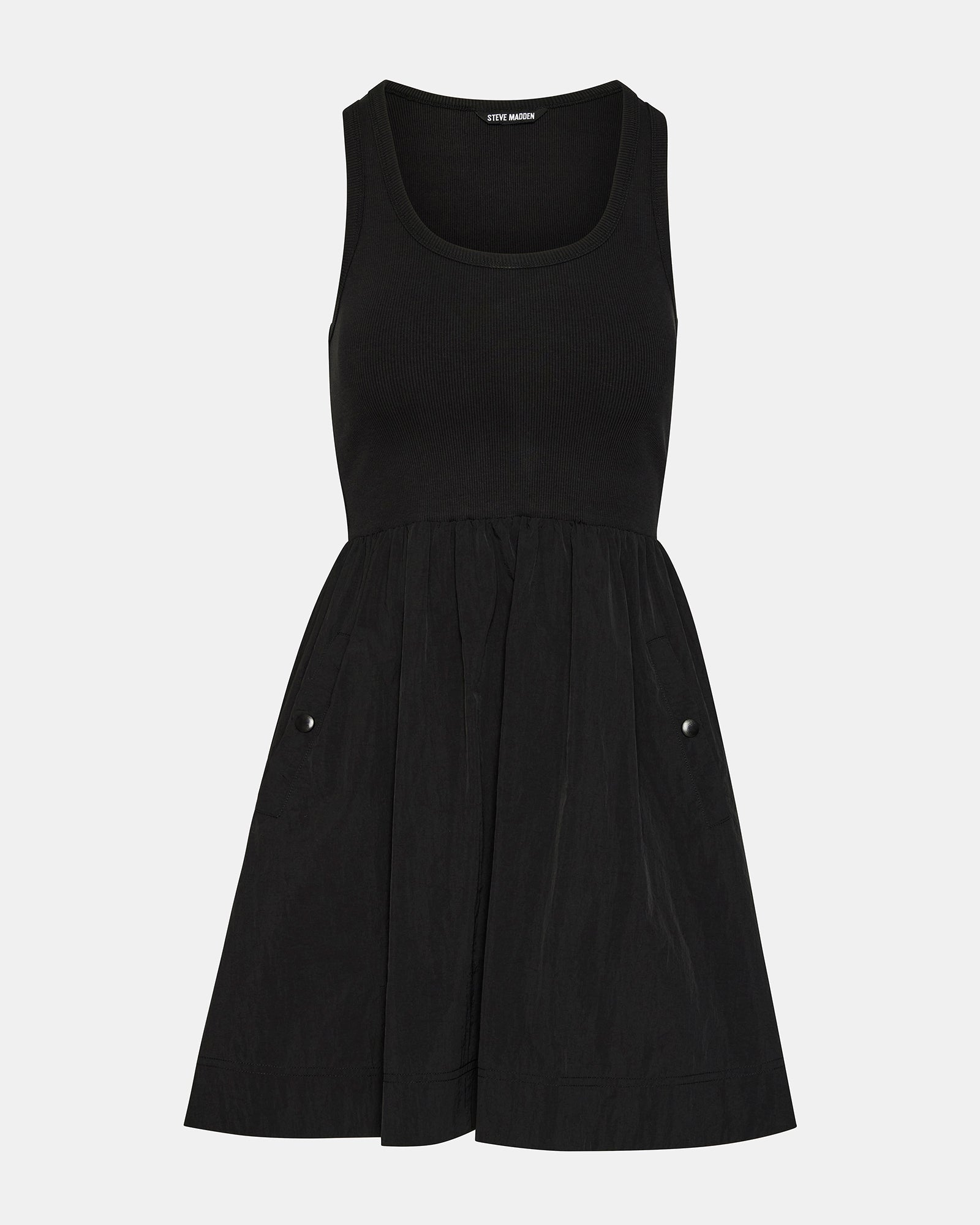 Model wearing black long sleeve mini dress layered over tank dress for cooler evenings