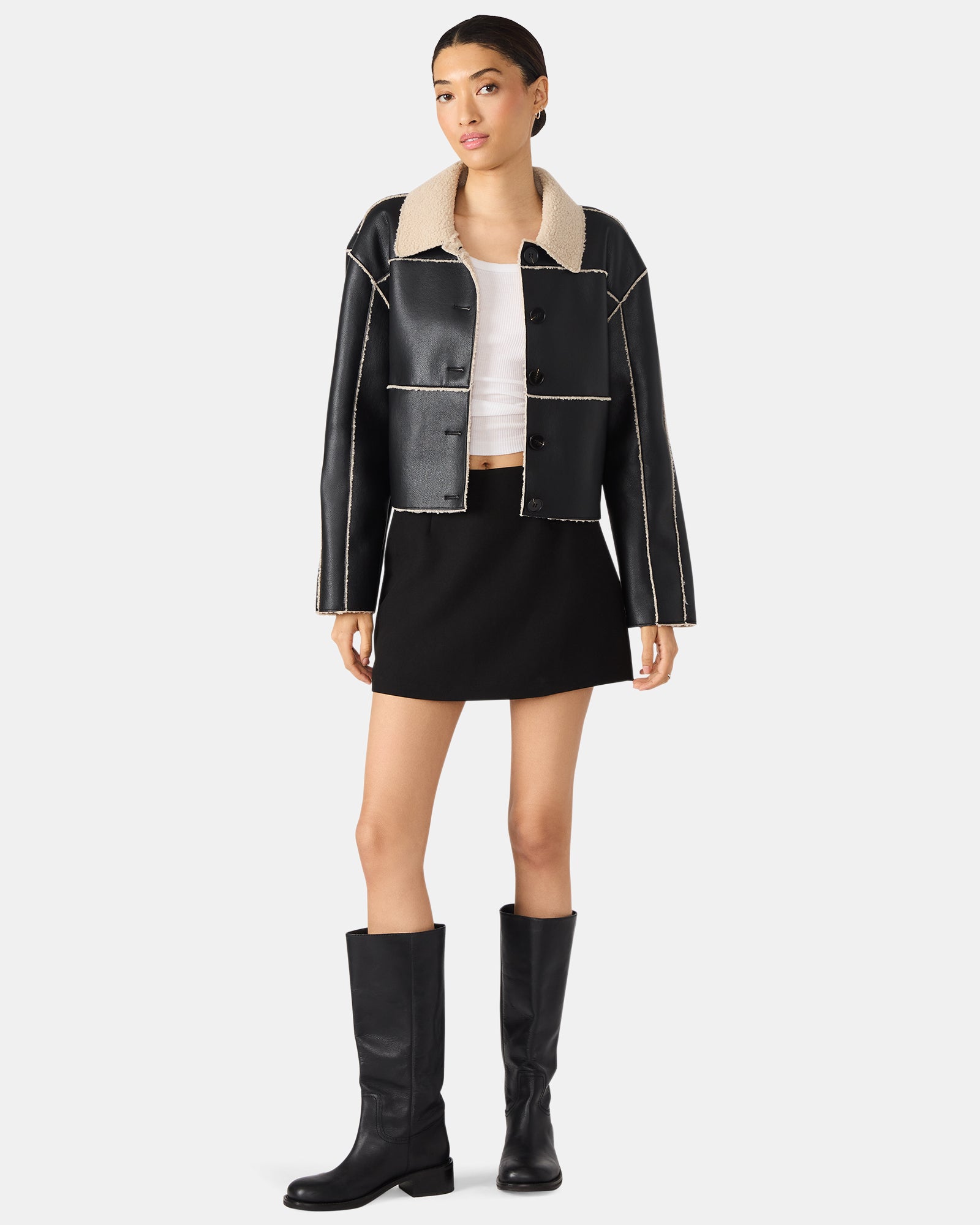 Close-up of the black mini skort with side zipper on a mannequin