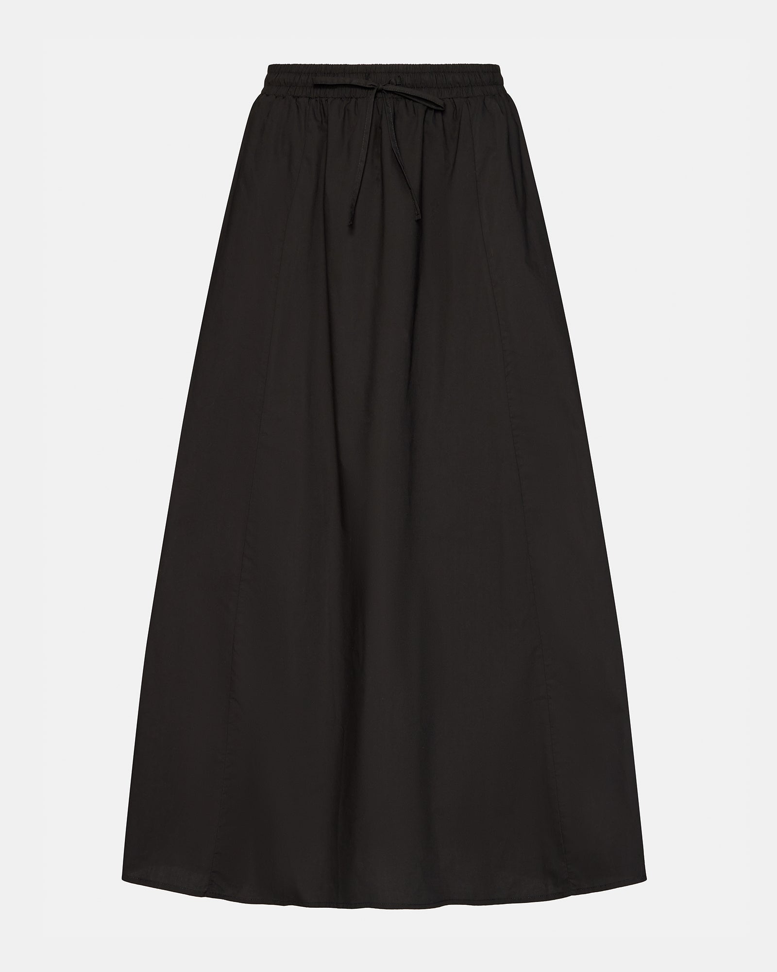 Full-length view of the black maxi skirt styled with a casual top