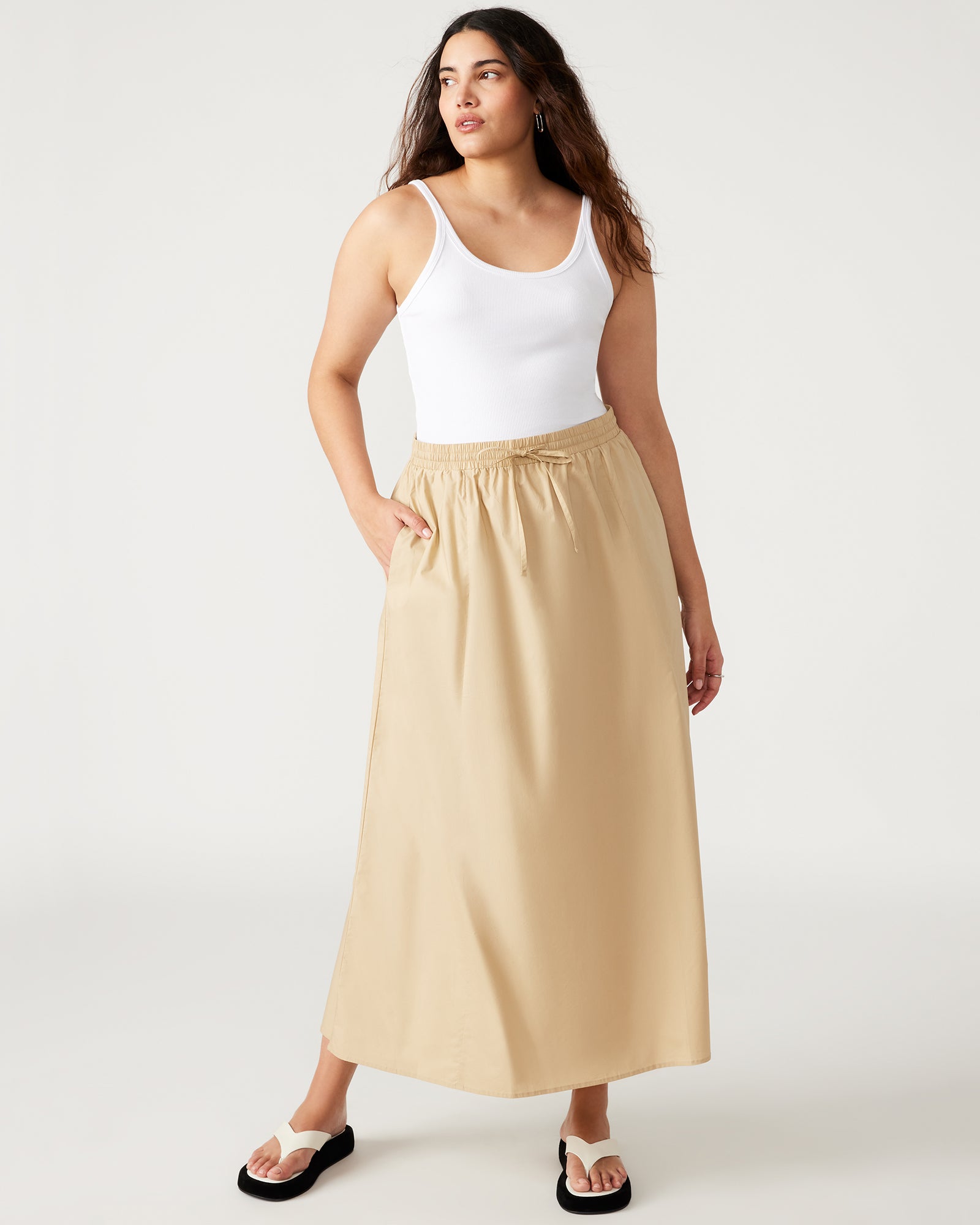 Side view of the khaki colour skirt showcasing the elastic waistband