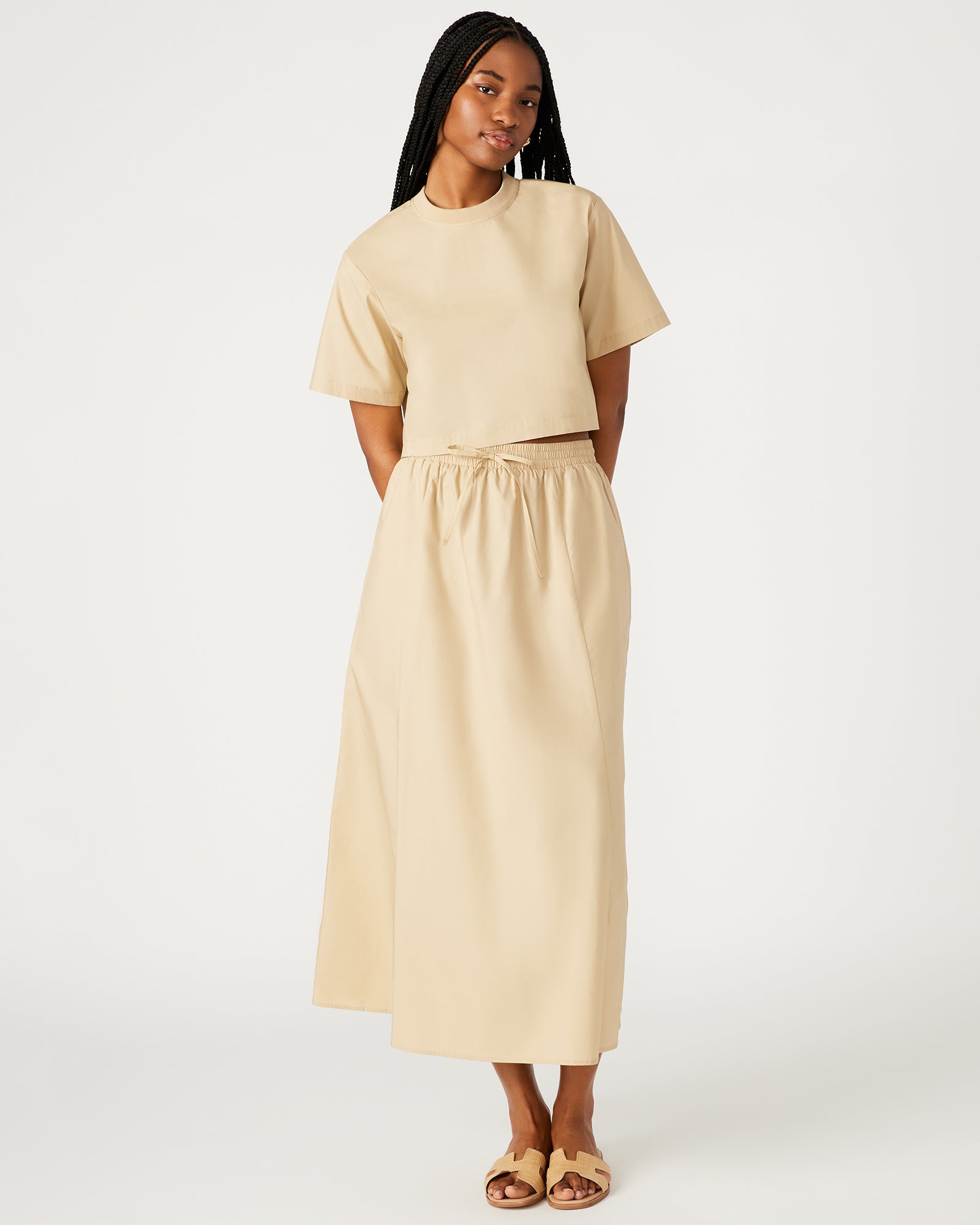 Front view of khaki A-line maxi skirt with pockets