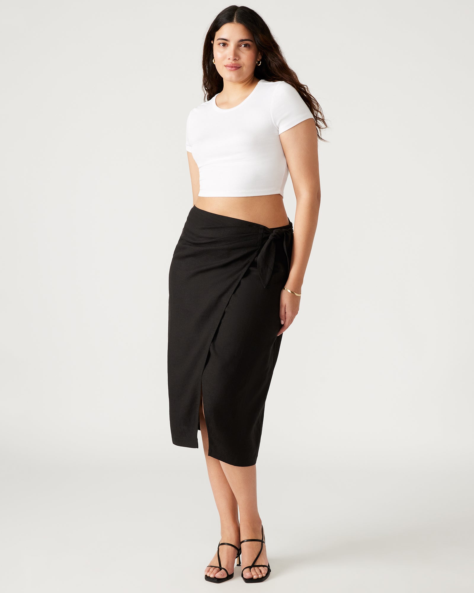 Side view of the Isadora wrap skirt midi showcasing its elegant drape.