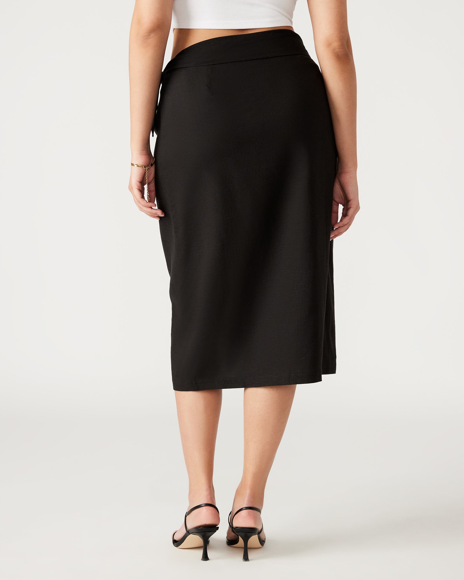 Side view of the Isadora wrap skirt midi showcasing its elegant drape.