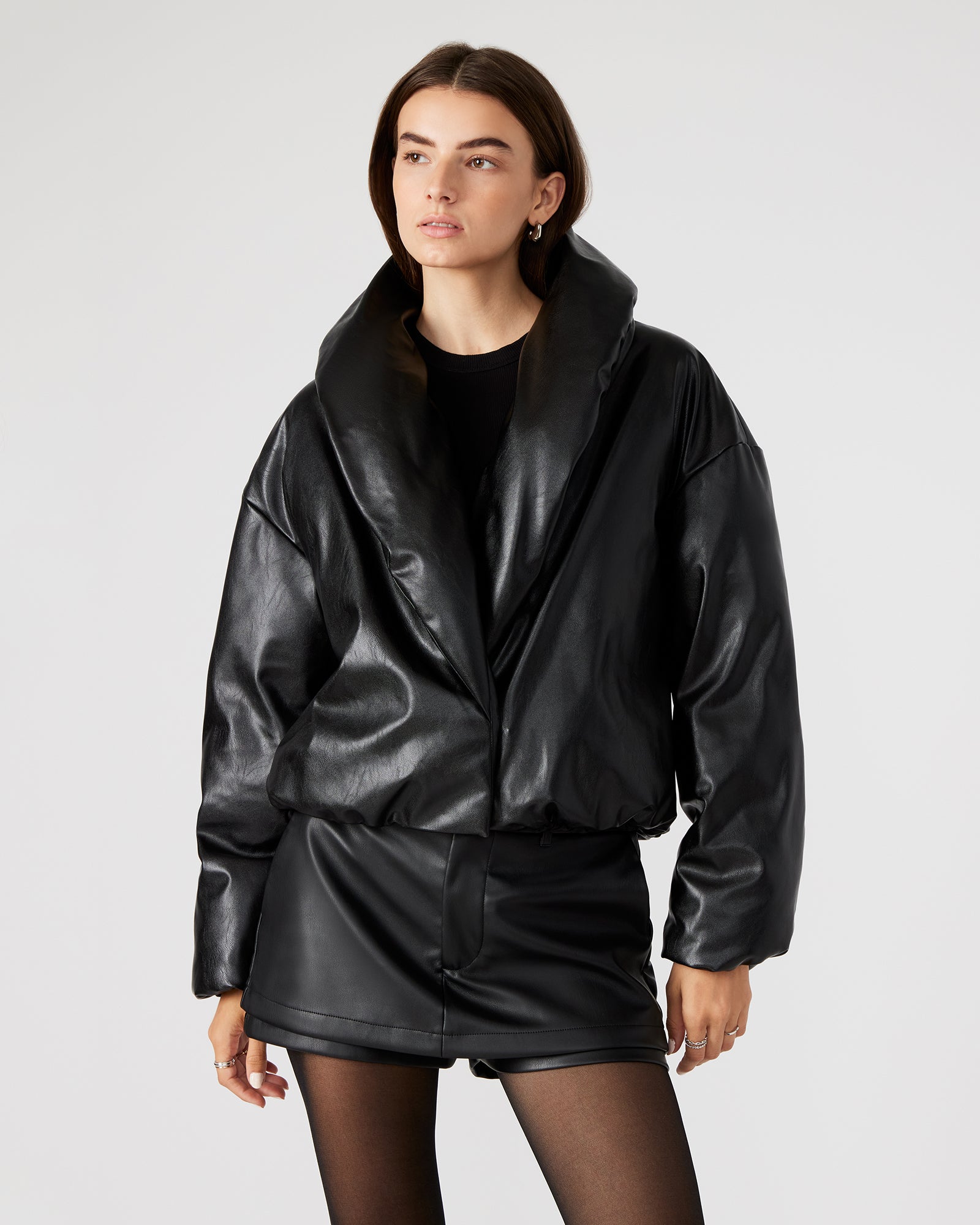 Front view of the black vegan leather puffer jacket showcasing the shawl collar.