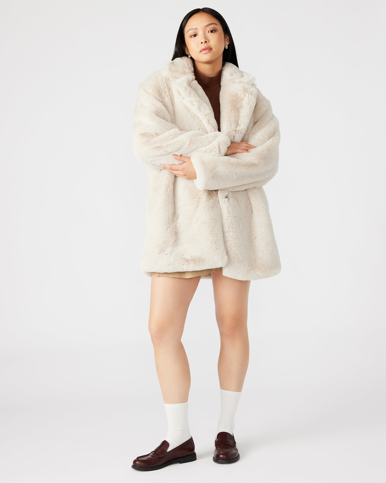 Side view of the oversized womens winter coat with pockets.