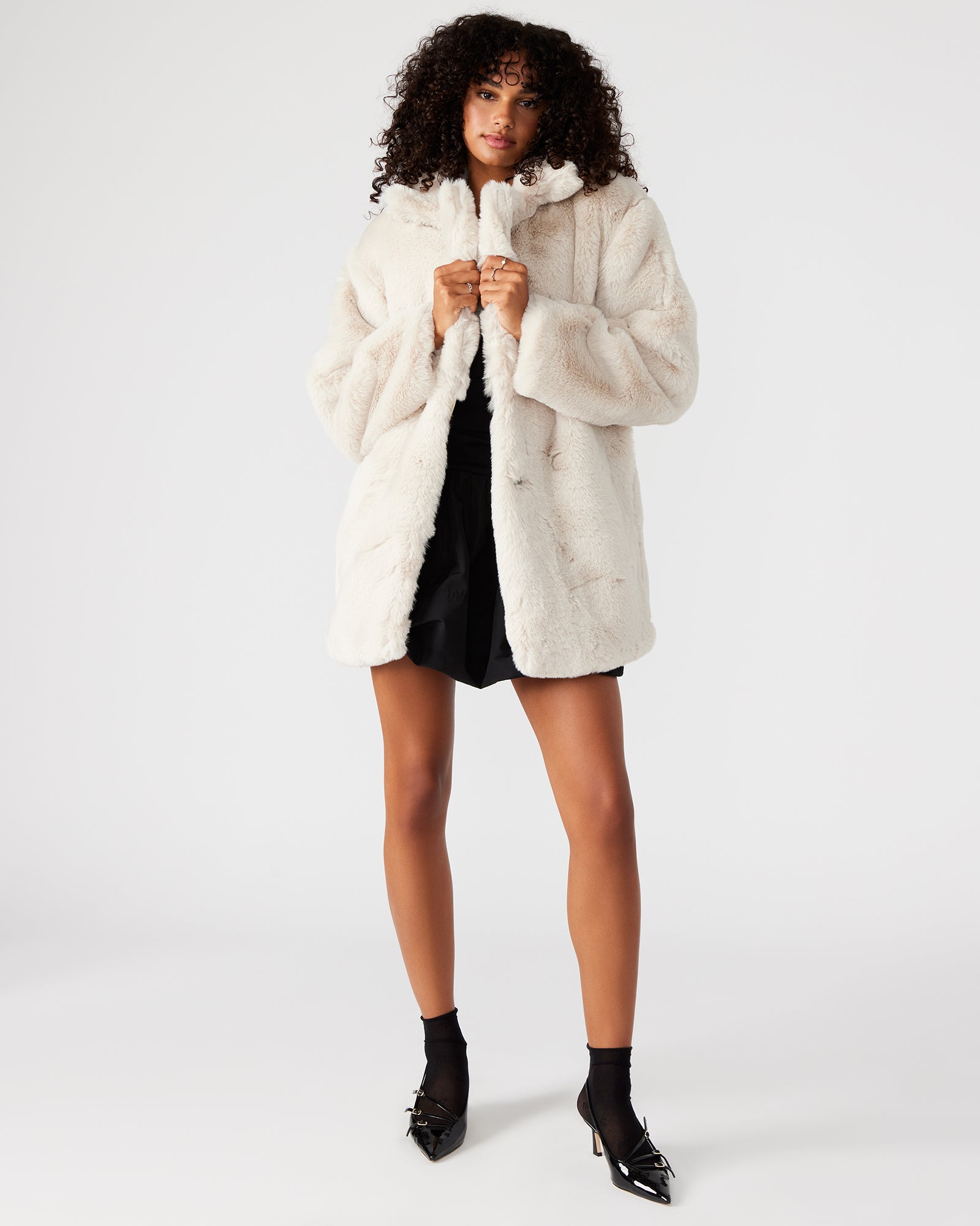 Close-up of the faux fur texture on the winter coat.