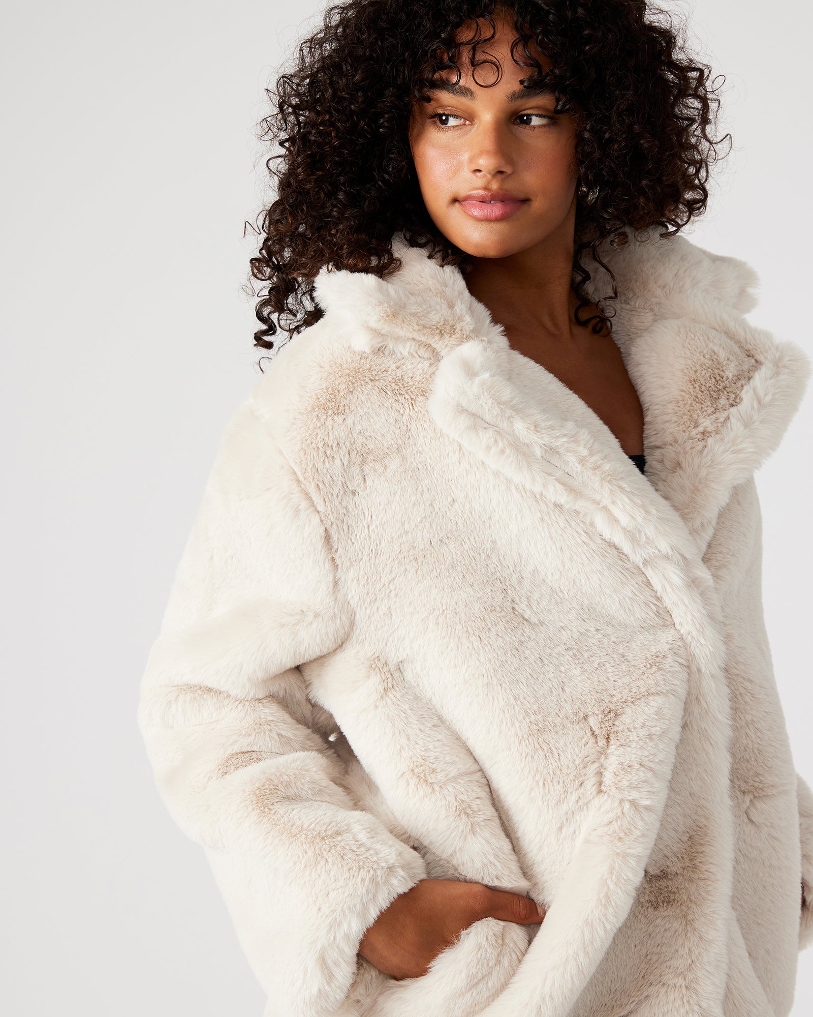 Side view of the oversized womens winter coat with pockets.